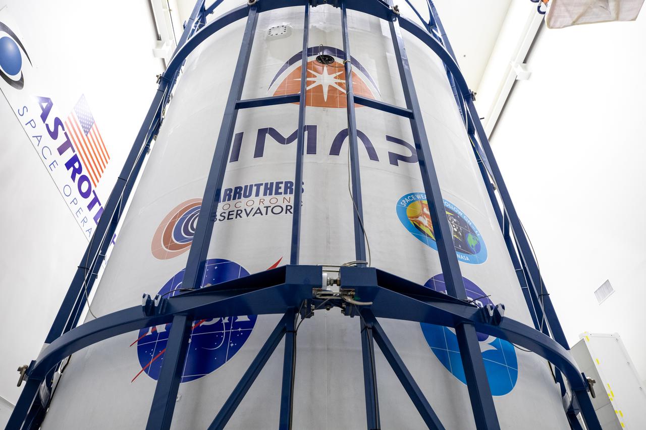 Technicians at Astrotech Space Operations Facility near NASA’s Kennedy Space Center in Florida encapsulate NASA’s IMAP (Interstellar Mapping and Acceleration Probe), along with the agency’s Carruthers Geocorona Observatory and National Oceanic and Atmospheric Administration’s (NOAA) Space Weather Follow On–Lagrange 1 (SWFO-L1) spacecraft on Tuesday, Sept. 16, 2025, inside a SpaceX Falcon 9 payload fairing. The missions will each focus on different effects of the solar wind — the continuous stream of particles emitted by the Sun — and space weather — the changing conditions in space driven by the Sun — from their origins at the Sun to their farthest reaches billions of miles away at the edge of our solar system. Liftoff of the missions on a SpaceX Falcon 9 rocket is targeted for 7:32 a.m. EDT, Tuesday, Sept. 23, from Launch Complex 39A at NASA Kennedy.