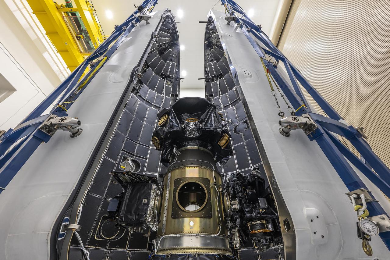 Technicians at Astrotech Space Operations Facility near NASA’s Kennedy Space Center in Florida encapsulate NASA’s IMAP (Interstellar Mapping and Acceleration Probe) spacecraft on Tuesday, Sept. 16, 2025, inside SpaceX’s Falcon 9 payload fairings to protect the spacecraft during launch. NASA’s IMAP will use 10 science instruments to study and map the heliosphere, a vast magnetic bubble surrounding the Sun protecting our solar system from radiation incoming from interstellar space. This mission and its two rideshares – NASA’s exosphere-studying Carruthers Geocorona Observatory and National Oceanic and Atmospheric Administration’s (NOAA) Space Weather Follow On–Lagrange 1 (SWFO-L1) observatory – will orbit the Sun near Lagrange point 1, about one million miles from Earth, where it will scan the heliosphere, analyze the composition of charged particles, and investigate how those particles move through the solar system. Launch is targeted for no earlier than Tuesday, Sept. 23, 2025, from Launch Complex 39A at NASA Kennedy.