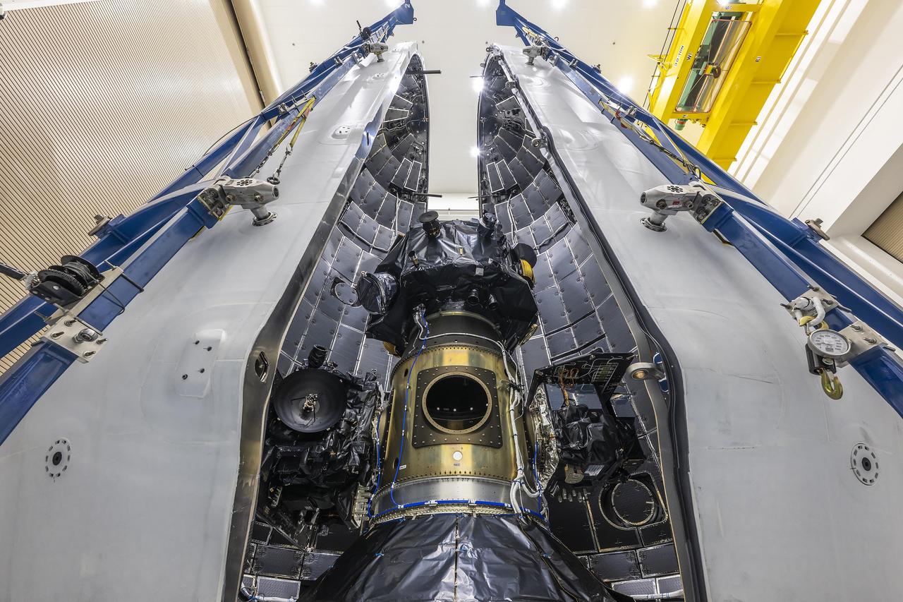 Technicians at Astrotech Space Operations Facility near NASA’s Kennedy Space Center in Florida encapsulate NASA’s IMAP (Interstellar Mapping and Acceleration Probe) spacecraft on Tuesday, Sept. 16, 2025, inside SpaceX’s Falcon 9 payload fairings to protect the spacecraft during launch. NASA’s IMAP will use 10 science instruments to study and map the heliosphere, a vast magnetic bubble surrounding the Sun protecting our solar system from radiation incoming from interstellar space. This mission and its two rideshares – NASA’s exosphere-studying Carruthers Geocorona Observatory and National Oceanic and Atmospheric Administration’s (NOAA) Space Weather Follow On–Lagrange 1 (SWFO-L1) observatory – will orbit the Sun near Lagrange point 1, about one million miles from Earth, where it will scan the heliosphere, analyze the composition of charged particles, and investigate how those particles move through the solar system. Launch is targeted for no earlier than Tuesday, Sept. 23, 2025, from Launch Complex 39A at NASA Kennedy.