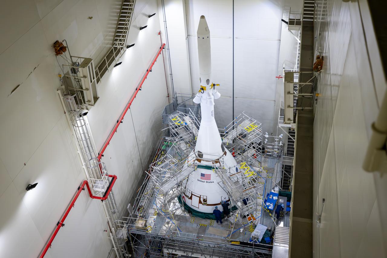 Teams with NASA’s Exploration Ground Systems attached the fourth and final ogive fairing for the launch abort system of the Orion spacecraft for the Artemis II mission. The fully installed fairings were photographed inside the Launch Abort System Facility high bay at NASA’s Kennedy Space Center in Florida on Sept. 17, 2025. The ogives are protective panels that will shield the crew module from the severe vibrations and sounds it will experience during launch, while the 44-foot-tall launch abort system will detach from the spacecraft after launch when it is no longer needed.