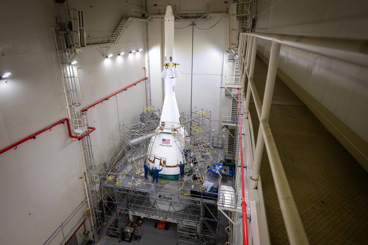 Teams with NASA’s Exploration Ground Systems attached the fourth and final ogive fairing for the launch abort system of the Orion spacecraft for the Artemis II mission. The fully installed fairings were photographed inside the Launch Abort System Facility high bay at NASA’s Kennedy Space Center in Florida on Sept. 17, 2025. The ogives are protective panels that will shield the crew module from the severe vibrations and sounds it will experience during launch, while the 44-foot-tall launch abort system will detach from the spacecraft after launch when it is no longer needed.