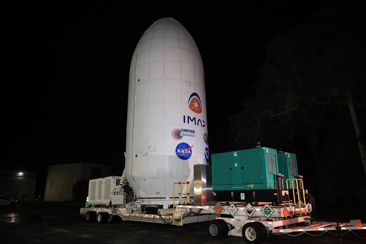 Workers transport NASA’s IMAP (Interstellar Mapping and Acceleration Probe) spacecraft along with the agency’s Carruthers Geocorona Observatory and National Oceanic and Atmospheric Administration’s (NOAA) Space Weather Follow On–Lagrange 1 (SWFO-L1) satellite late on Wednesday, Sept. 17, 2025, through early Thursday, Sept. 18, 2025, from the Astrotech Space Operations Facility in Titusville Florida, to the SpaceX hangar at Launch Complex 39A at the agency’s Kennedy Space Center in Florida. Technicians will soon mate the three spacecraft to a SpaceX Falcon 9 rocket in preparation for launch. Liftoff is targeted for 7:32 a.m. EDT, Tuesday, Sept. 23, from Launch Complex 39A at NASA Kennedy.