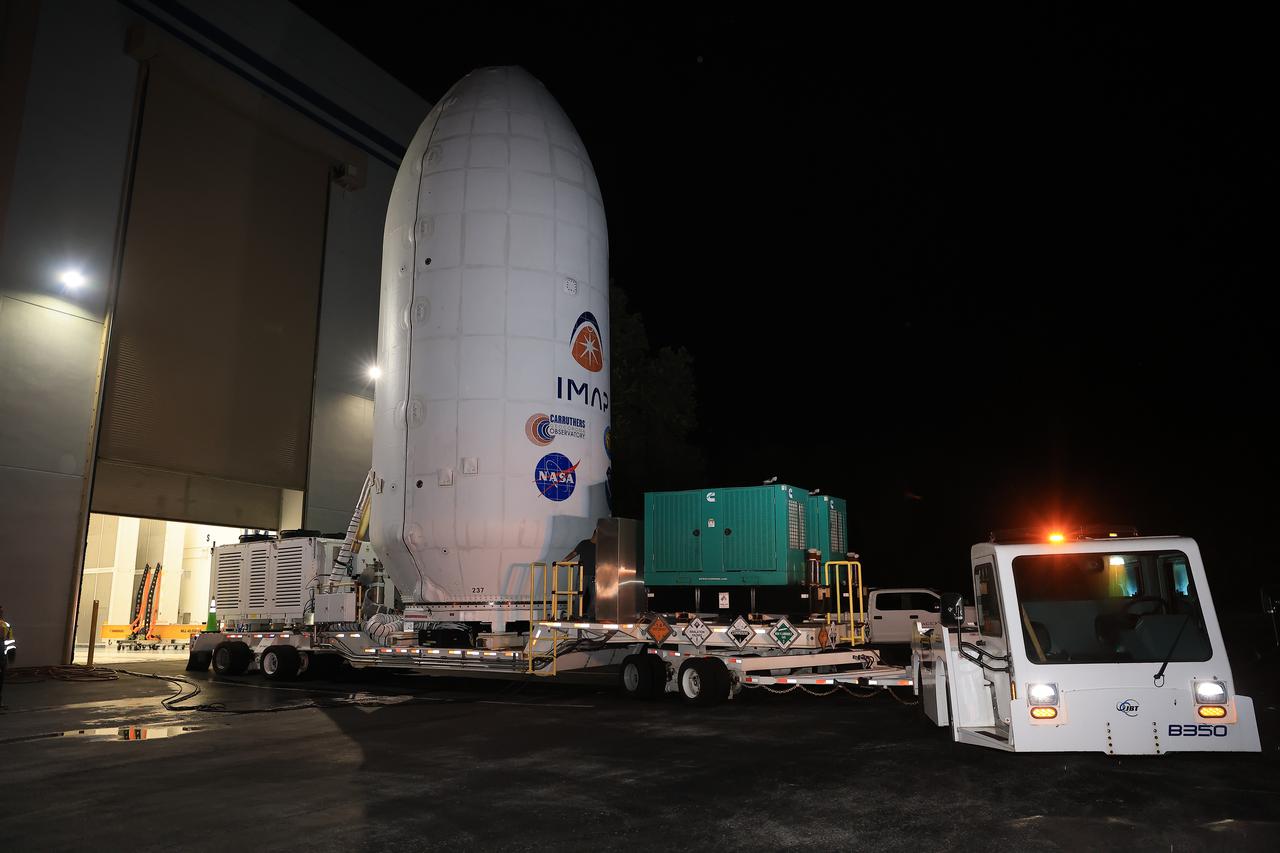 Workers transport NASA’s IMAP (Interstellar Mapping and Acceleration Probe) spacecraft along with the agency’s Carruthers Geocorona Observatory and National Oceanic and Atmospheric Administration’s (NOAA) Space Weather Follow On–Lagrange 1 (SWFO-L1) satellite late on Wednesday, Sept. 17, 2025, through early Thursday, Sept. 18, 2025, from the Astrotech Space Operations Facility in Titusville Florida, to the SpaceX hangar at Launch Complex 39A at the agency’s Kennedy Space Center in Florida. Technicians will soon mate the three spacecraft to a SpaceX Falcon 9 rocket in preparation for launch. Liftoff is targeted for 7:32 a.m. EDT, Tuesday, Sept. 23, from Launch Complex 39A at NASA Kennedy.