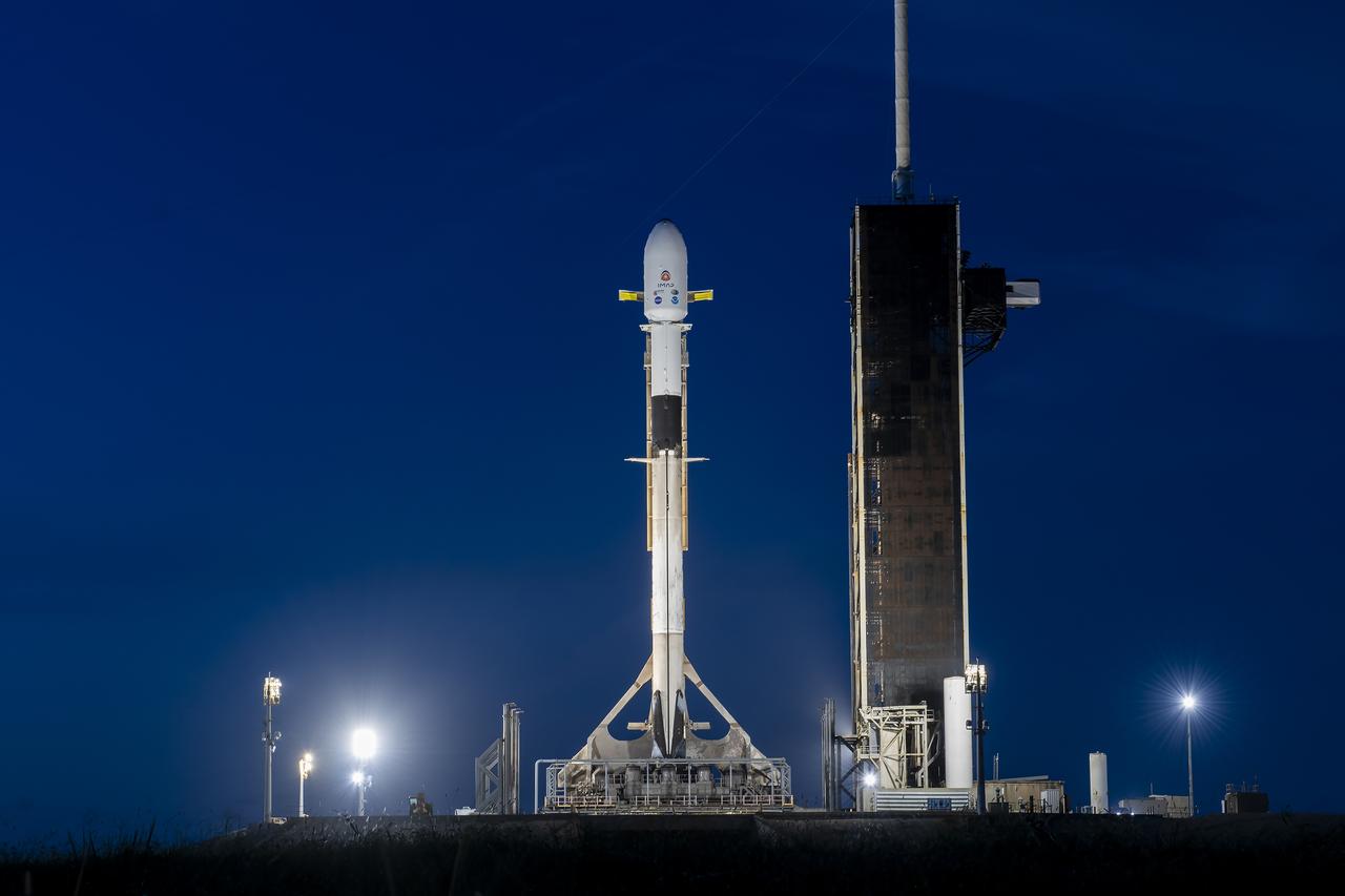A SpaceX Falcon 9 rocket with NASA’s IMAP (Interstellar Mapping and Acceleration Probe), the agency’s Carruthers Geocorona Observatory, and National Oceanic and Atmospheric Administration’s (NOAA) Space Weather Follow On–Lagrange 1 (SWFO-L1) spacecraft stands vertical at Launch Complex 39A during early morning on Monday, Sept. 22, 2025, at the agency’s Kennedy Space Center in Florida. NASA’s IMAP will use 10 science instruments to study and map the heliosphere, a vast magnetic bubble surrounding the Sun protecting our solar system from radiation incoming from interstellar space. NASA’s IMAP will scan the heliosphere, analyze the composition of charged particles, and investigate how those particles move through the solar system.