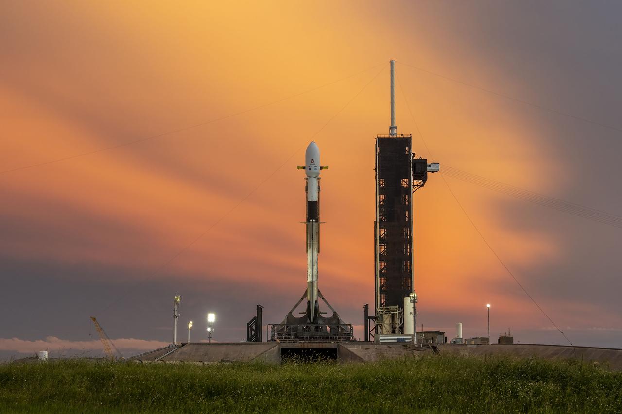 A SpaceX Falcon 9 rocket with NASA’s IMAP (Interstellar Mapping and Acceleration Probe), the agency’s Carruthers Geocorona Observatory, and National Oceanic and Atmospheric Administration’s (NOAA) Space Weather Follow On–Lagrange 1 (SWFO-L1) spacecraft atop stands vertical at Launch Complex 39A as the sun sets on Monday, Sept. 22, 2025, at the agency’s Kennedy Space Center in Florida. The missions will each focus on different effects of the solar wind — the continuous stream of particles emitted by the Sun — and space weather — the changing conditions in space driven by the Sun — from their origins at the Sun to their farthest reaches billions of miles away at the edge of our solar system.