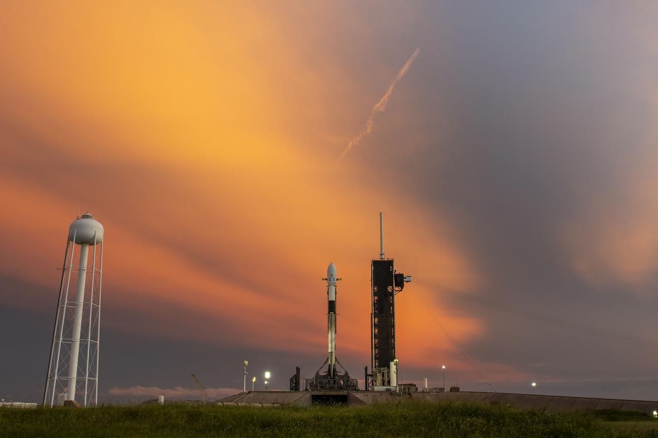 A SpaceX Falcon 9 rocket with NASA’s IMAP (Interstellar Mapping and Acceleration Probe), the agency’s Carruthers Geocorona Observatory, and National Oceanic and Atmospheric Administration’s (NOAA) Space Weather Follow On–Lagrange 1 (SWFO-L1) spacecraft atop stands vertical at Launch Complex 39A as the sun sets on Monday, Sept. 22, 2025, at the agency’s Kennedy Space Center in Florida. The missions will each focus on different effects of the solar wind — the continuous stream of particles emitted by the Sun — and space weather — the changing conditions in space driven by the Sun — from their origins at the Sun to their farthest reaches billions of miles away at the edge of our solar system.