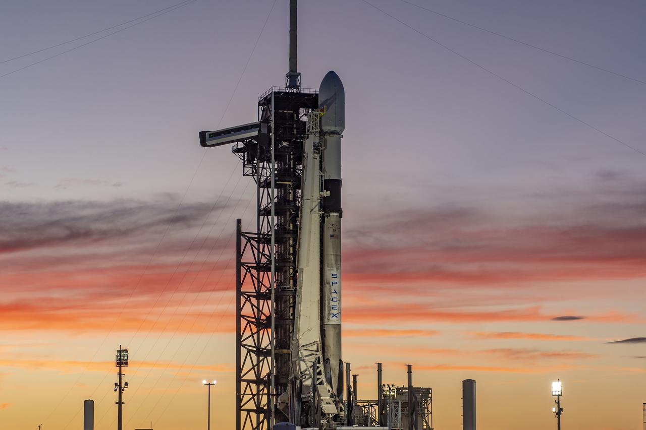 A SpaceX Falcon 9 rocket with NASA’s IMAP (Interstellar Mapping and Acceleration Probe), the agency’s Carruthers Geocorona Observatory, and National Oceanic and Atmospheric Administration’s (NOAA) Space Weather Follow On–Lagrange 1 (SWFO-L1) spacecraft atop stands vertical at Launch Complex 39A as the sun sets on Monday, Sept. 22, 2025, at the agency’s Kennedy Space Center in Florida. The missions will each focus on different effects of the solar wind — the continuous stream of particles emitted by the Sun — and space weather — the changing conditions in space driven by the Sun — from their origins at the Sun to their farthest reaches billions of miles away at the edge of our solar system.