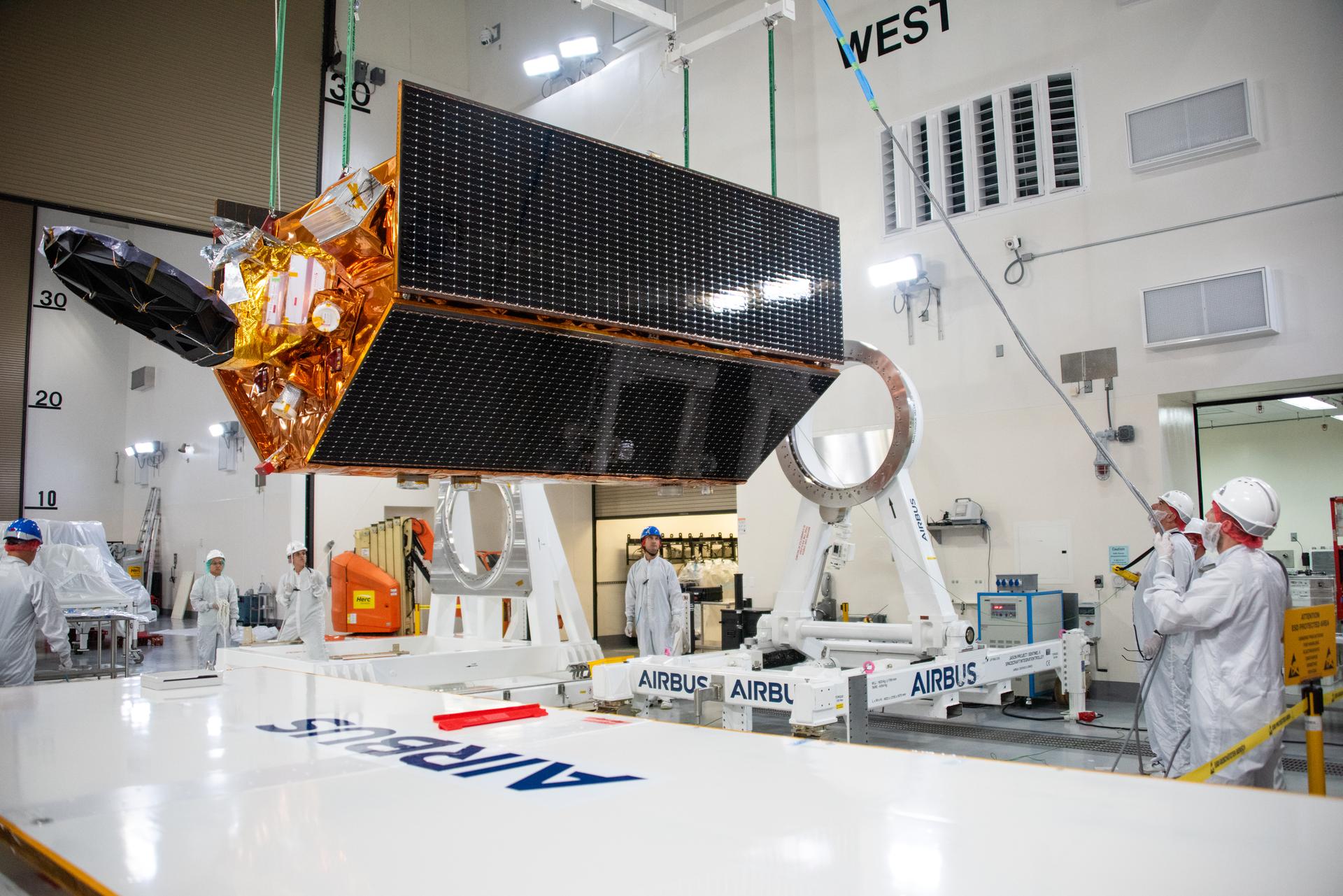 Technicians use a crane to place the Sentinel-6B spacecraft onto a work stand ahead of prelaunch operations at the Astrotech Space Operations payload processing facility at Vandenberg Space Force Base in California on Thursday, Sept. 25, 2025. Sentinel-6B will undergo detailed inspections, tests, and fueling in a cleanroom as it prepares for a November launch on a SpaceX Falcon 9 rocket. A collaboration between NASA, ESA (European Space Agency), EUMETSAT (European Organisation for the Exploitation of Meteorological Satellites), and the National Oceanic and Atmospheric Administration (NOAA), Sentinel-6B is designed to measure sea levels down to roughly an inch for about 90% of the world’s oceans and will extend out to a decade the record of atmospheric temperatures begun by Sentinel-6 Michael Freilich.
