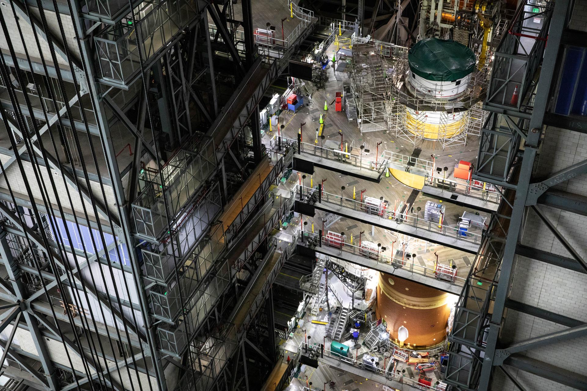 Technicians with NASA’s Exploration Ground Systems Program attach the Orion stage adapter to the interim cryogenic propulsion stage atop the agency’s SLS (Space Launch System) Moon rocket inside Vehicle Assembly Building at NASA’s Kennedy Space Center on Wednesday, Sept. 30, 2025. During the Artemis II test flight, the Orion stage adapter separates from the interim cryogenic propulsion stage, deploying four science payloads into high-Earth orbit. Up next, the Orion spacecraft and its launch abort system will stack atop the Orion stage adapter to complete integration and prepare for the launch of four astronauts around the Moon and back in early 2026.