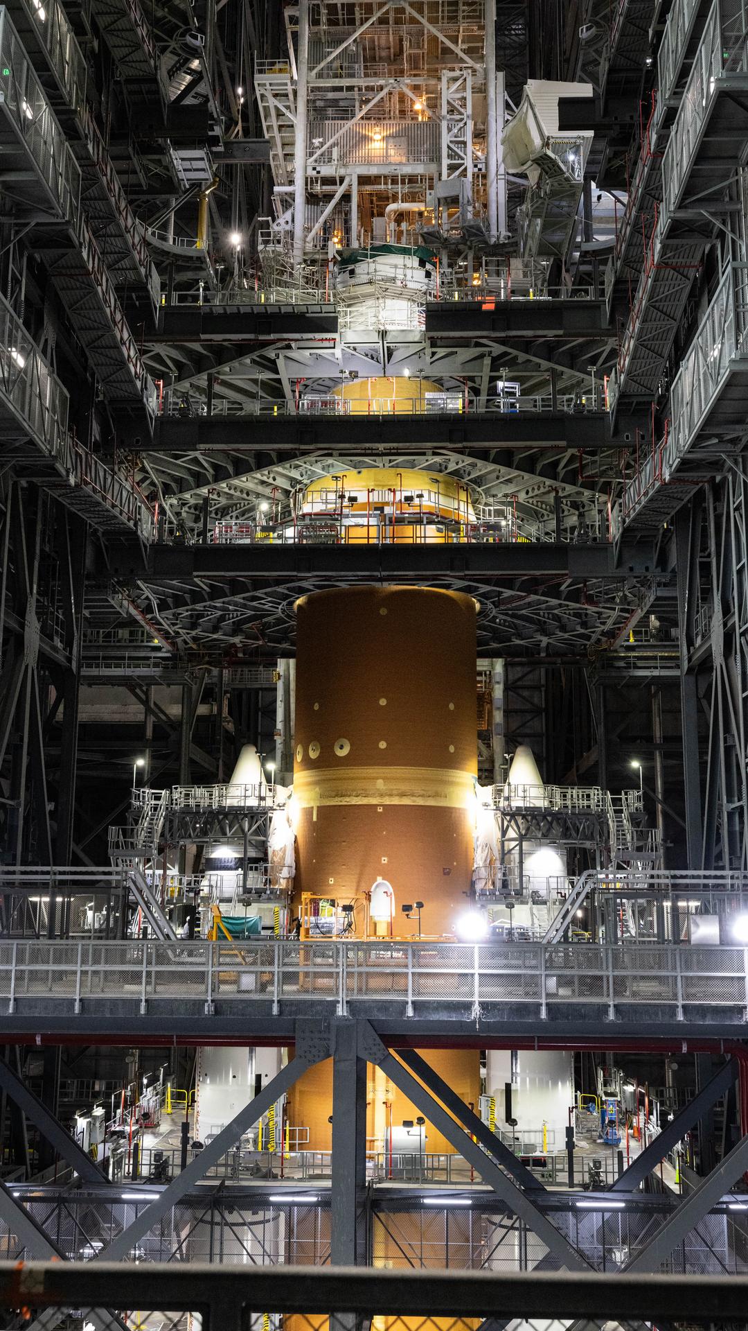 Technicians with NASA’s Exploration Ground Systems Program attach the Orion stage adapter to the interim cryogenic propulsion stage atop the agency’s SLS (Space Launch System) Moon rocket inside Vehicle Assembly Building at NASA’s Kennedy Space Center on Wednesday, Sept. 30, 2025. During the Artemis II test flight, the Orion stage adapter separates from the interim cryogenic propulsion stage, deploying four science payloads into high-Earth orbit. Up next, the Orion spacecraft and its launch abort system will stack atop the Orion stage adapter to complete integration and prepare for the launch of four astronauts around the Moon and back in early 2026.