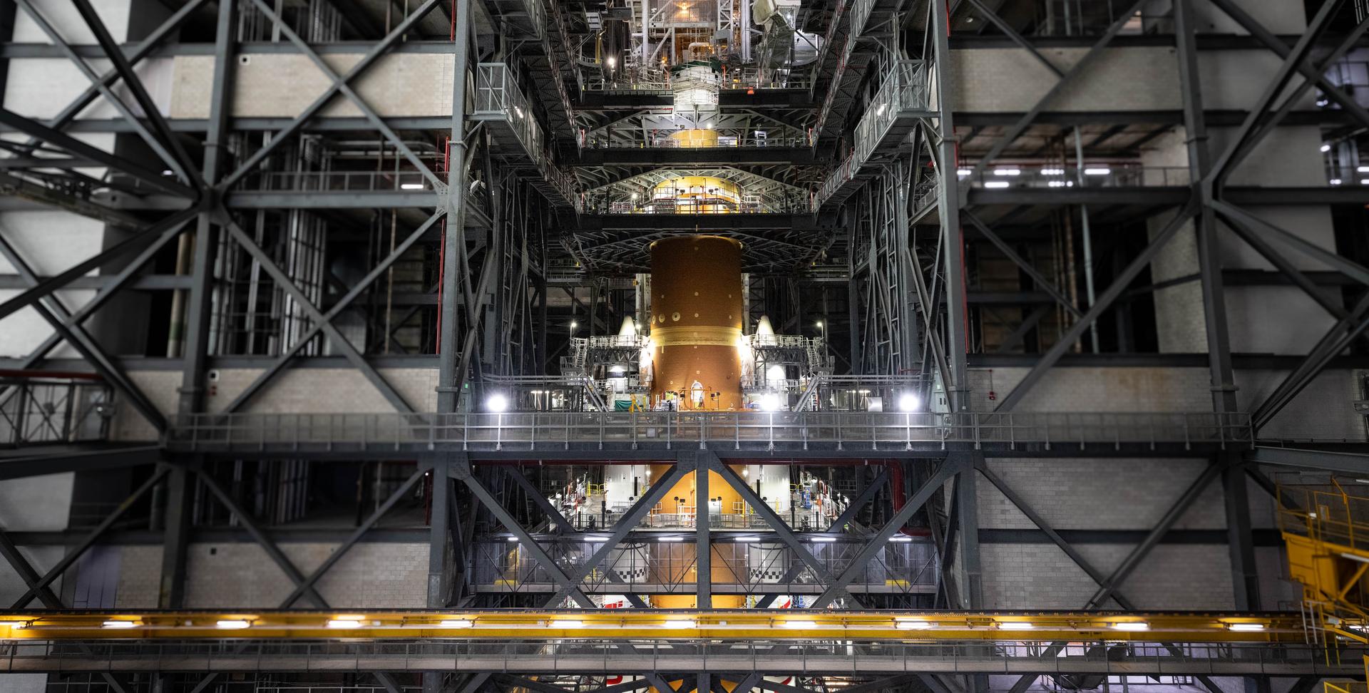 Technicians with NASA’s Exploration Ground Systems Program attach the Orion stage adapter to the interim cryogenic propulsion stage atop the agency’s SLS (Space Launch System) Moon rocket inside Vehicle Assembly Building at NASA’s Kennedy Space Center on Wednesday, Sept. 30, 2025. During the Artemis II test flight, the Orion stage adapter separates from the interim cryogenic propulsion stage, deploying four science payloads into high-Earth orbit. Up next, the Orion spacecraft and its launch abort system will stack atop the Orion stage adapter to complete integration and prepare for the launch of four astronauts around the Moon and back in early 2026.