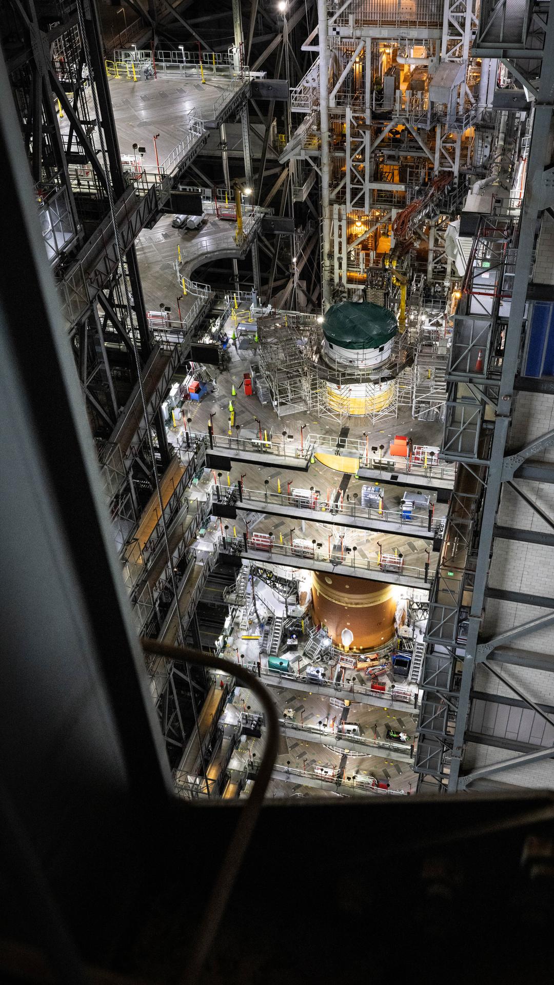 Technicians with NASA’s Exploration Ground Systems Program attach the Orion stage adapter to the interim cryogenic propulsion stage atop the agency’s SLS (Space Launch System) Moon rocket inside Vehicle Assembly Building at NASA’s Kennedy Space Center on Wednesday, Sept. 30, 2025. During the Artemis II test flight, the Orion stage adapter separates from the interim cryogenic propulsion stage, deploying four science payloads into high-Earth orbit. Up next, the Orion spacecraft and its launch abort system will stack atop the Orion stage adapter to complete integration and prepare for the launch of four astronauts around the Moon and back in early 2026.