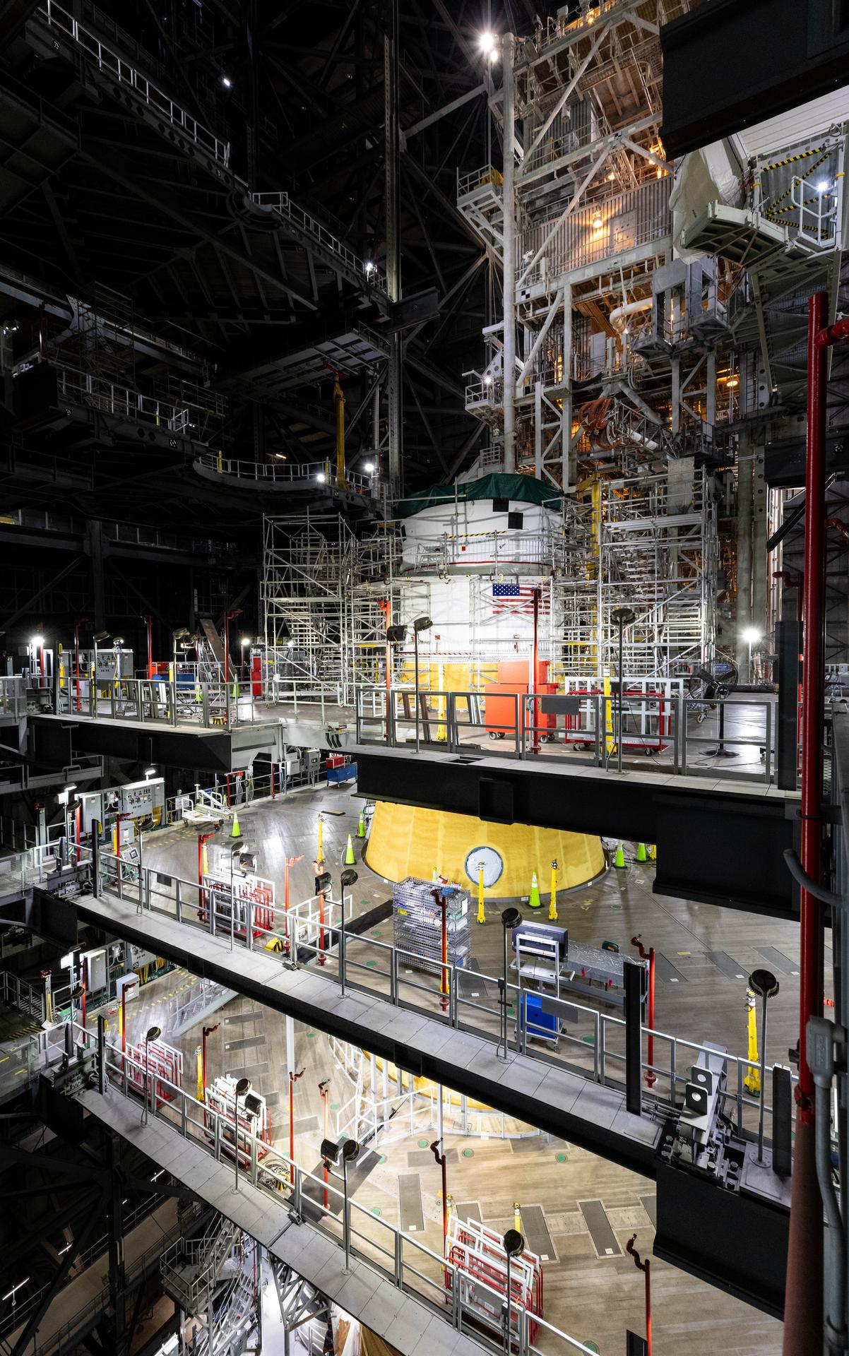 Technicians with NASA’s Exploration Ground Systems Program attach the Orion stage adapter to the interim cryogenic propulsion stage atop the agency’s SLS (Space Launch System) Moon rocket inside Vehicle Assembly Building at NASA’s Kennedy Space Center on Wednesday, Sept. 30, 2025. During the Artemis II test flight, the Orion stage adapter separates from the interim cryogenic propulsion stage, deploying four science payloads into high-Earth orbit. Up next, the Orion spacecraft and its launch abort system will stack atop the Orion stage adapter to complete integration and prepare for the launch of four astronauts around the Moon and back in early 2026.