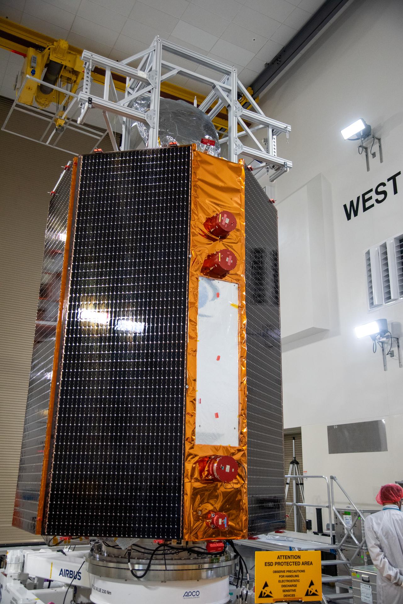 Technicians test the solar arrays during processing of the Sentinel-6B spacecraft during prelaunch operations at the Astrotech Space Operations payload processing facility at Vandenberg Space Force Base in California on Thursday, Oct. 16, 2025. Sentinel-6B will undergo detailed inspections, tests, and fueling in a cleanroom as it prepares for a November launch on a SpaceX Falcon 9 rocket. A collaboration between NASA, ESA (European Space Agency), EUMETSAT (European Organisation for the Exploitation of Meteorological Satellites), and the National Oceanic and Atmospheric Administration (NOAA), Sentinel-6B is designed to measure sea levels down to roughly an inch for about 90% of the world’s oceans.
