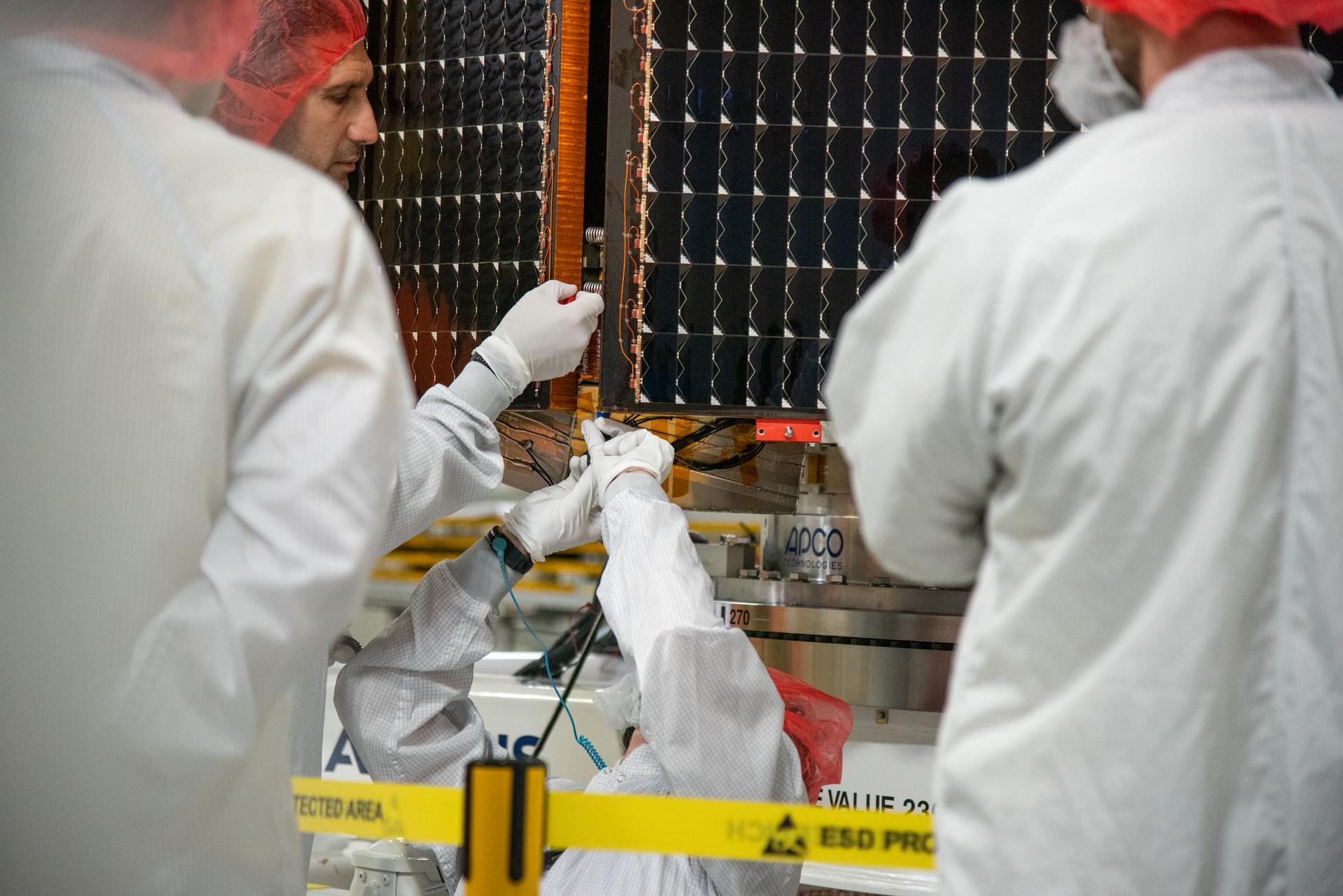 Technicians test the solar arrays during processing of the Sentinel-6B spacecraft during prelaunch operations at the Astrotech Space Operations payload processing facility at Vandenberg Space Force Base in California on Thursday, Oct. 16, 2025. Sentinel-6B will undergo detailed inspections, tests, and fueling in a cleanroom as it prepares for a November launch on a SpaceX Falcon 9 rocket. A collaboration between NASA, ESA (European Space Agency), EUMETSAT (European Organisation for the Exploitation of Meteorological Satellites), and the National Oceanic and Atmospheric Administration (NOAA), Sentinel-6B is designed to measure sea levels down to roughly an inch for about 90% of the world’s oceans.
