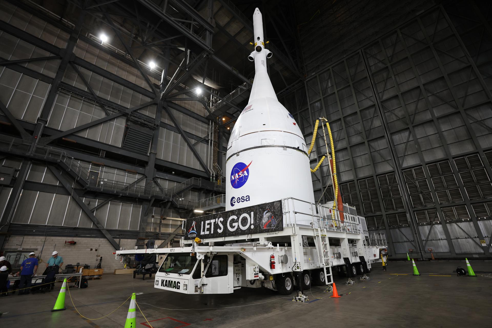 Technicians with NASA’s Exploration Ground Systems team prepare for integration to attach the agency’s Orion spacecraft on top of the SLS (Space Launch System) rocket in High Bay 3 of the Vehicle Assembly Building at NASA’s Kennedy Space Center in Florida on Friday, Oct. 17, 2025, for the agency’s Artemis II mission. Set to launch in 2026, the spacecraft will carry NASA astronauts Reid Wiseman, Victor Glover, Christina Koch, and CSA (Canadian Space Agency) astronaut Jeremy Hansen on a 10-day mission around the Moon and back. Once stacked, teams will begin conducting a series of verification tests ahead of rolling out to Launch Complex 39B for the wet dress rehearsal at NASA Kennedy. 