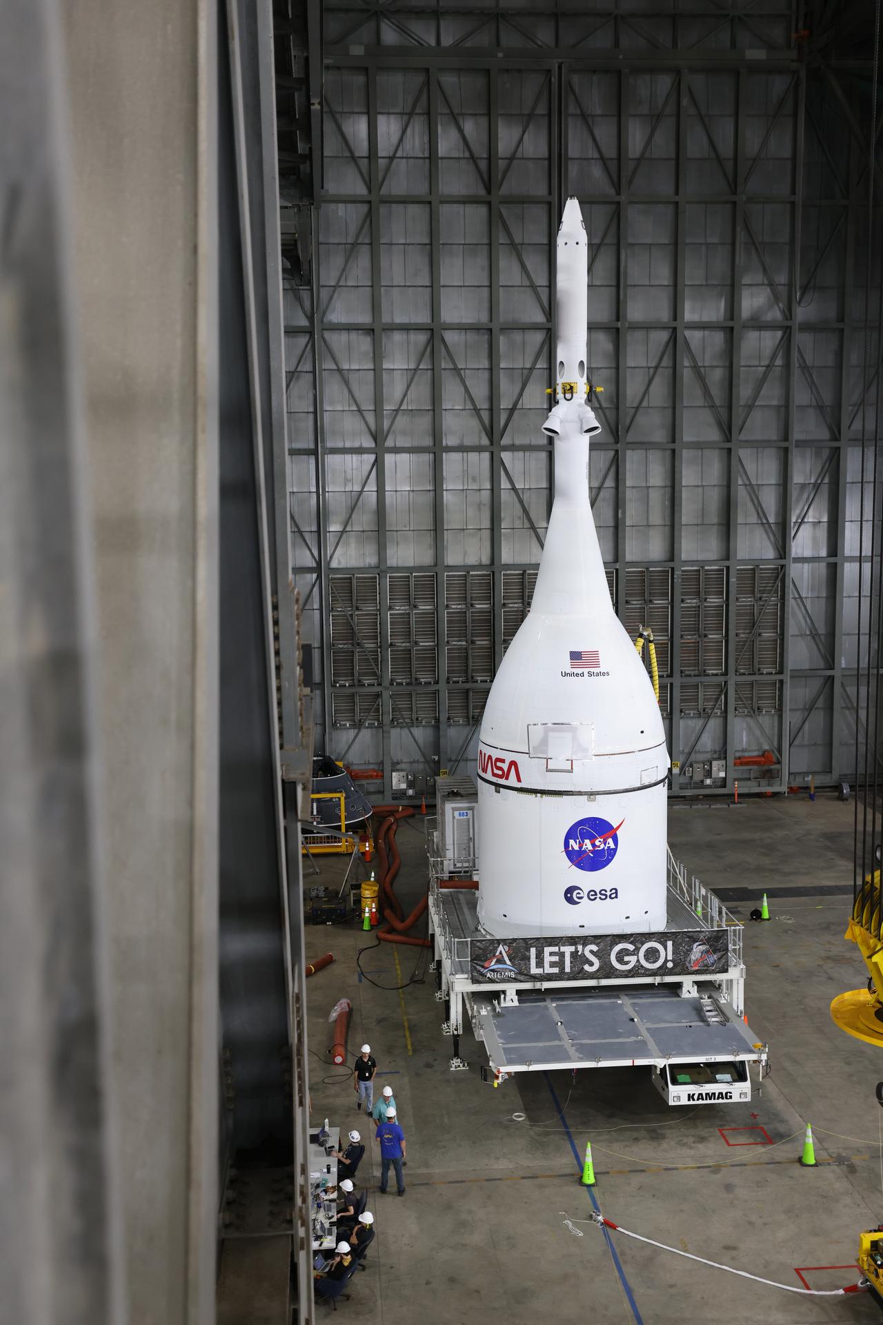 Technicians with NASA’s Exploration Ground Systems team prepare for integration to attach the agency’s Orion spacecraft on top of the SLS (Space Launch System) rocket in High Bay 3 of the Vehicle Assembly Building at NASA’s Kennedy Space Center in Florida on Friday, Oct. 17, 2025, for the agency’s Artemis II mission. Set to launch in 2026, the spacecraft will carry NASA astronauts Reid Wiseman, Victor Glover, Christina Koch, and CSA (Canadian Space Agency) astronaut Jeremy Hansen on a 10-day mission around the Moon and back. Once stacked, teams will begin conducting a series of verification tests ahead of rolling out to Launch Complex 39B for the wet dress rehearsal at NASA Kennedy. 