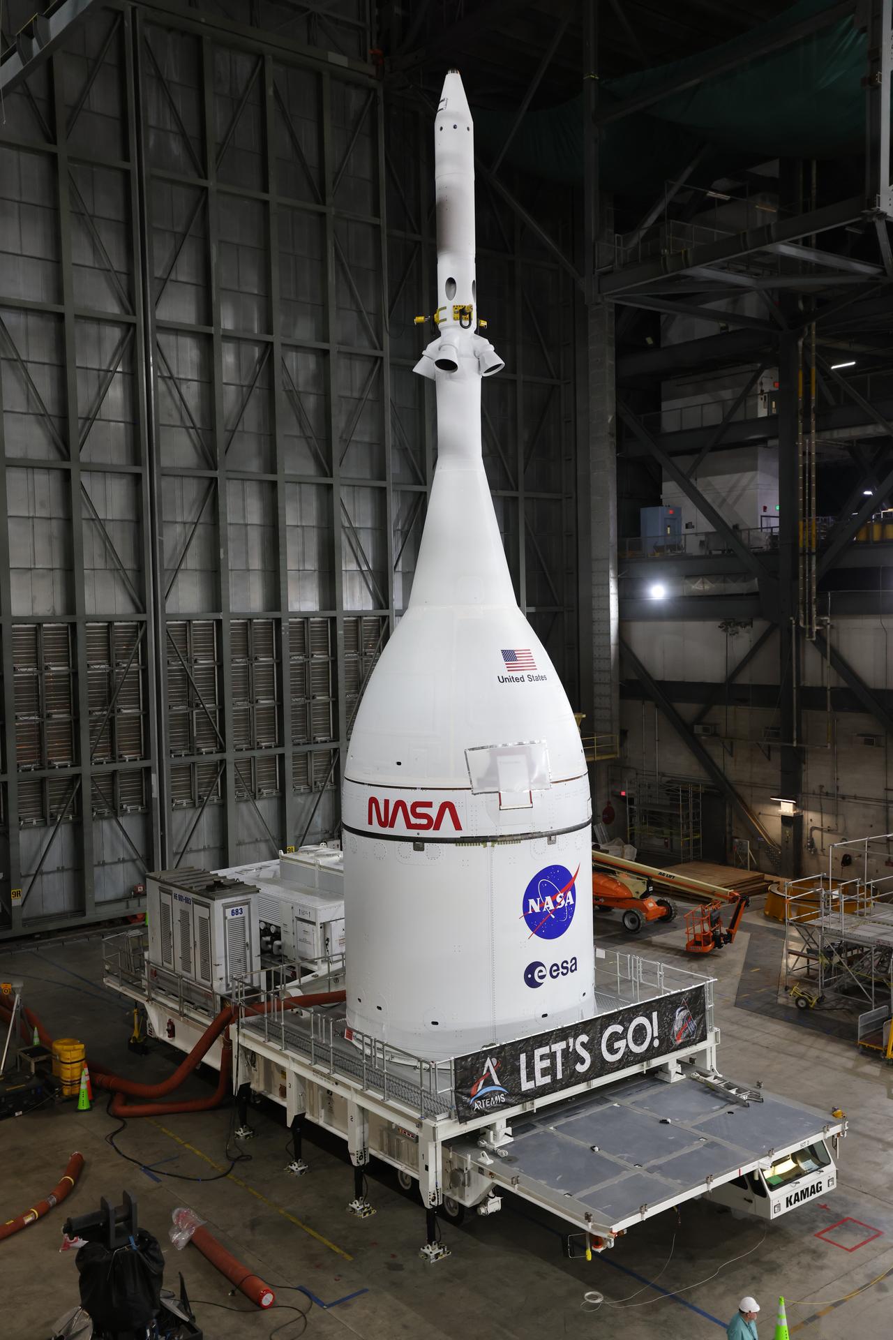 Technicians with NASA’s Exploration Ground Systems team prepare for integration to attach the agency’s Orion spacecraft on top of the SLS (Space Launch System) rocket in High Bay 3 of the Vehicle Assembly Building at NASA’s Kennedy Space Center in Florida on Friday, Oct. 17, 2025, for the agency’s Artemis II mission. Set to launch in 2026, the spacecraft will carry NASA astronauts Reid Wiseman, Victor Glover, Christina Koch, and CSA (Canadian Space Agency) astronaut Jeremy Hansen on a 10-day mission around the Moon and back. Once stacked, teams will begin conducting a series of verification tests ahead of rolling out to Launch Complex 39B for the wet dress rehearsal at NASA Kennedy. 