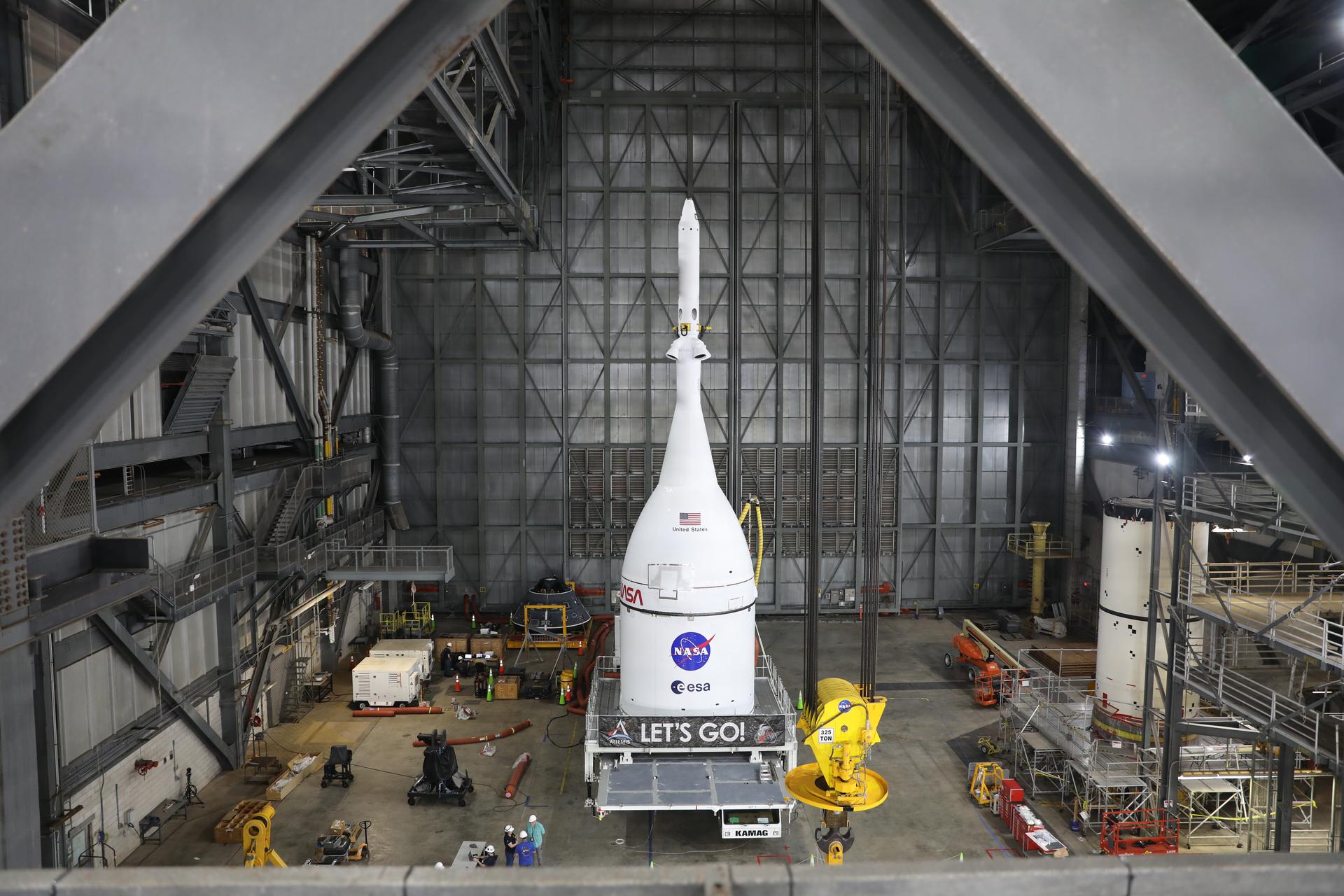 Technicians with NASA’s Exploration Ground Systems team prepare for integration to attach the agency’s Orion spacecraft on top of the SLS (Space Launch System) rocket in High Bay 3 of the Vehicle Assembly Building at NASA’s Kennedy Space Center in Florida on Friday, Oct. 17, 2025, for the agency’s Artemis II mission. Set to launch in 2026, the spacecraft will carry NASA astronauts Reid Wiseman, Victor Glover, Christina Koch, and CSA (Canadian Space Agency) astronaut Jeremy Hansen on a 10-day mission around the Moon and back. Once stacked, teams will begin conducting a series of verification tests ahead of rolling out to Launch Complex 39B for the wet dress rehearsal at NASA Kennedy. 