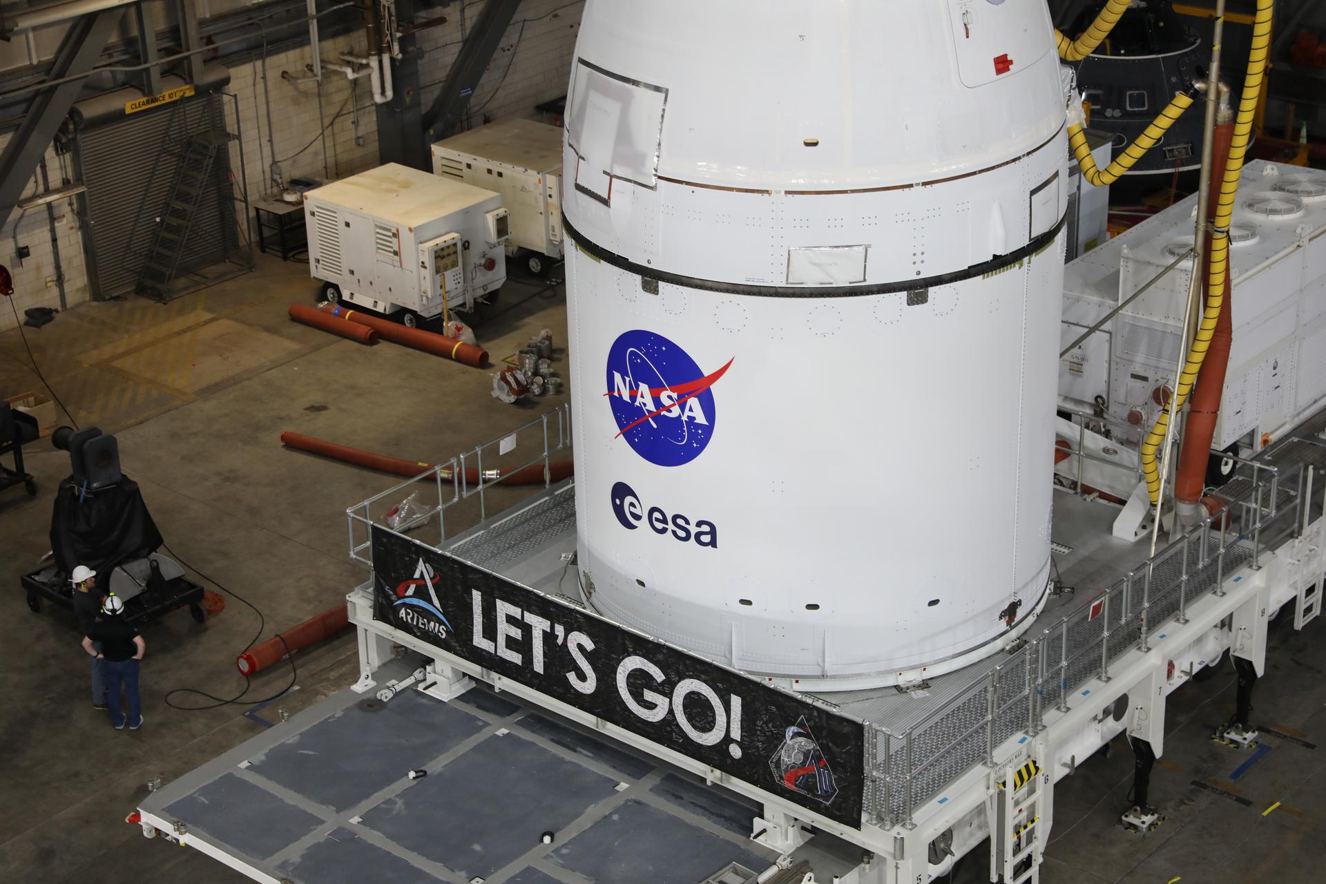 Technicians with NASA’s Exploration Ground Systems team prepare for integration to attach the agency’s Orion spacecraft on top of the SLS (Space Launch System) rocket in High Bay 3 of the Vehicle Assembly Building at NASA’s Kennedy Space Center in Florida on Friday, Oct. 17, 2025, for the agency’s Artemis II mission. Set to launch in 2026, the spacecraft will carry NASA astronauts Reid Wiseman, Victor Glover, Christina Koch, and CSA (Canadian Space Agency) astronaut Jeremy Hansen on a 10-day mission around the Moon and back. Once stacked, teams will begin conducting a series of verification tests ahead of rolling out to Launch Complex 39B for the wet dress rehearsal at NASA Kennedy. 