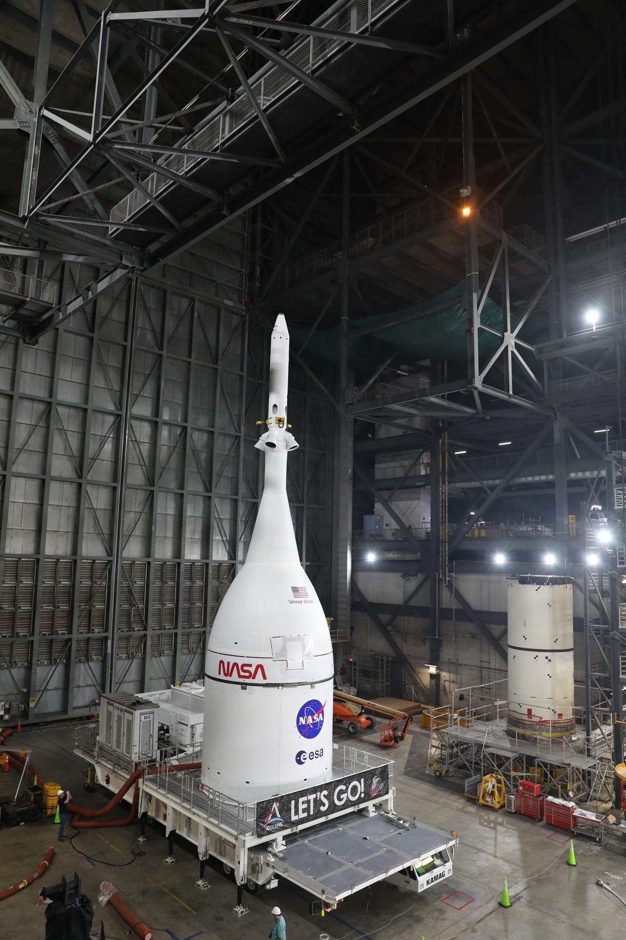 Technicians with NASA’s Exploration Ground Systems team prepare for integration to attach the agency’s Orion spacecraft on top of the SLS (Space Launch System) rocket in High Bay 3 of the Vehicle Assembly Building at NASA’s Kennedy Space Center in Florida on Friday, Oct. 17, 2025, for the agency’s Artemis II mission. Set to launch in 2026, the spacecraft will carry NASA astronauts Reid Wiseman, Victor Glover, Christina Koch, and CSA (Canadian Space Agency) astronaut Jeremy Hansen on a 10-day mission around the Moon and back. Once stacked, teams will begin conducting a series of verification tests ahead of rolling out to Launch Complex 39B for the wet dress rehearsal at NASA Kennedy. 