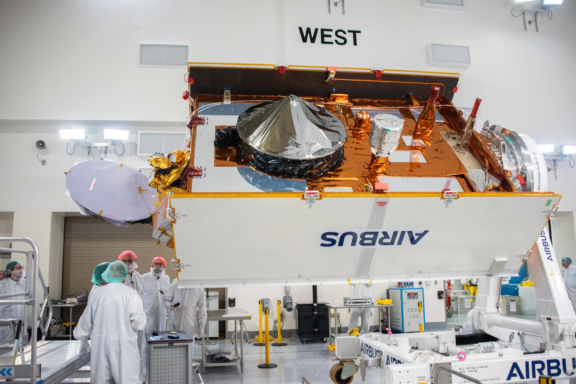 Technicians install multi-layer insulation on the Sentinel-6B spacecraft on a work stand inside the Astrotech Space Operations payload processing facility at Vandenberg Space Force Base in California on Thursday, Oct. 23, 2025. Critical for protecting spacecraft from extreme temperatures and environmental conditions in space, the thin, reflective multi-layer insulation will create a barrier to help reduce heat transfer through radiation while Sentinel-6B is in orbit. A collaboration between NASA, ESA (European Space Agency), EUMETSAT (European Organisation for the Exploitation of Meteorological Satellites), and the National Oceanic and Atmospheric Administration (NOAA), Sentinel-6B is designed to measure sea levels down to roughly an inch for about 90% of the world’s oceans. NASA is targeting launch no earlier than Sunday, Nov. 16, 2025, on a SpaceX Falcon 9 rocket from Space Launch Complex 4 East at Vandenberg.
