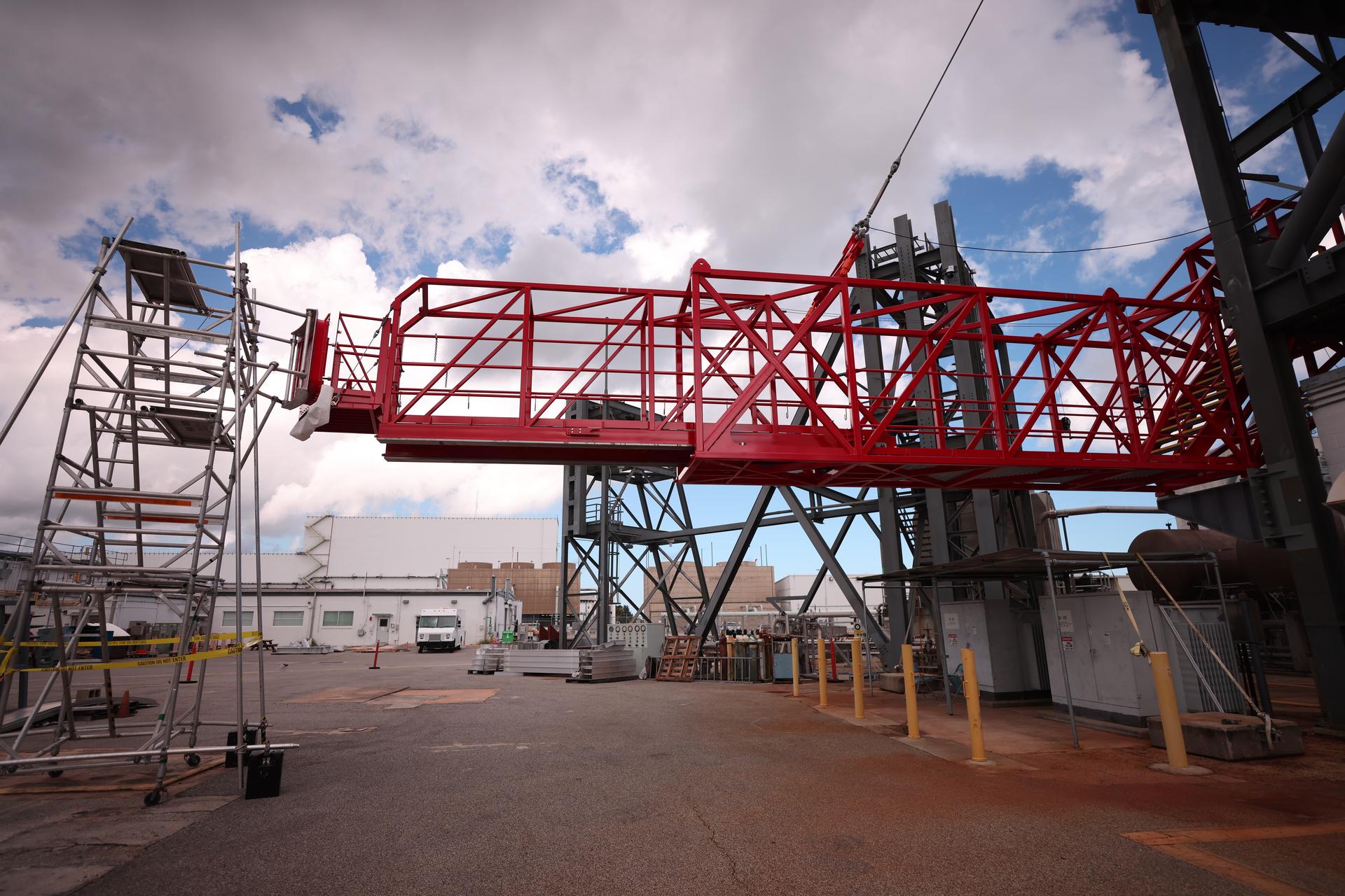 Crews test temporary contingency access platforms on the mobile launcher simulator tower on Wednesday, Oct. 29, 2025, at the Launch Equipment Test Facility at NASA’s Kennedy Space Center in Florida. The platforms will allow engineers to access the vehicle’s flight termination system on the rocket and the mobile launcher while at the pad rather than rolling back to the Vehicle Assembly Building to retest them. For Artemis II, four astronauts will venture around the Moon in early 2026, the first crewed mission on NASA’s path to establishing a long-term presence for science and exploration through Artemis.