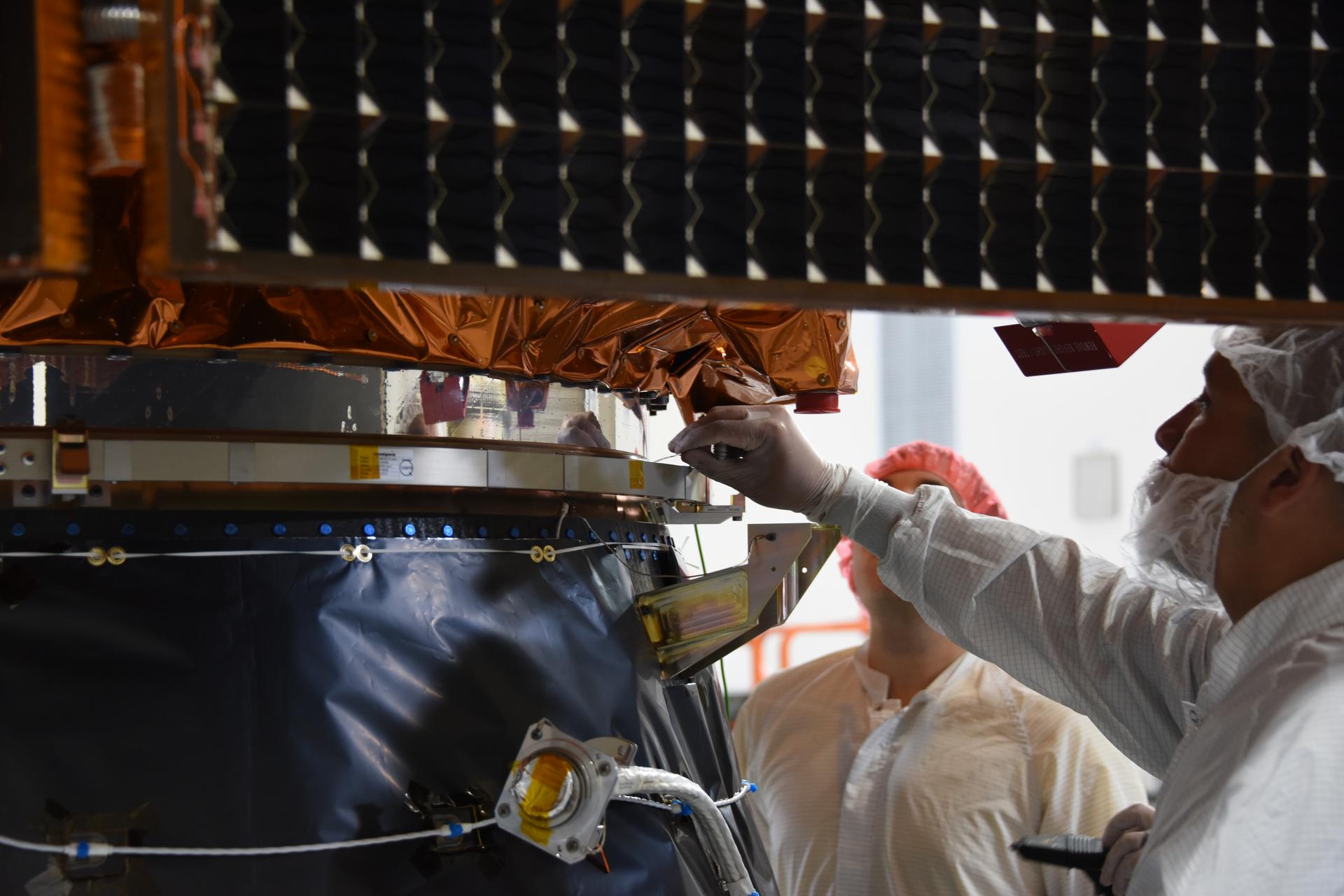 Technicians integrate the Sentinel-6B spacecraft to the payload adapter inside the Astrotech Space Operations payload processing facility at Vandenberg Space Force Base in California on Tuesday, Nov. 4, 2025. The payload adapter is part of the system that connects Sentinel-6B to the second stage of the SpaceX Falcon 9 rocket that will carry it to orbit. A collaboration between NASA, ESA (European Space Agency), EUMETSAT (European Organisation for the Exploitation of Meteorological Satellites), and the National Oceanic and Atmospheric Administration (NOAA), Sentinel-6B is designed to measure sea levels down to roughly an inch for about 90% of the world’s oceans. NASA is targeting launch no earlier than Sunday, Nov. 16, on a SpaceX Falcon 9 rocket from Space Launch Complex 4 East at Vandenberg.