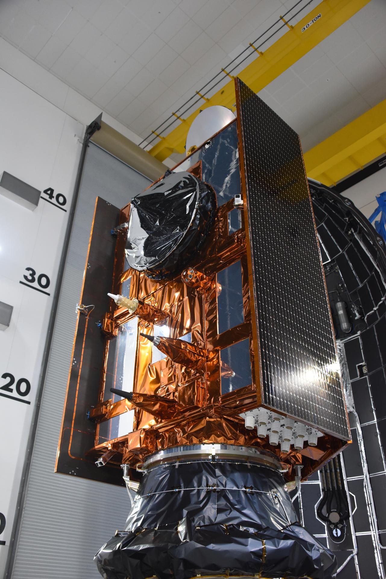 Technicians and engineers encapsulate the Sentinel-6B spacecraft within a protective payload fairing inside the Astrotech Space Operations facility at Vandenberg Space Force Base in California, on Monday, Nov. 10, 2025. A collaboration between NASA, ESA (European Space Agency), EUMETSAT (European Organisation for the Exploitation of Meteorological Satellites), and the National Oceanic and Atmospheric Administration (NOAA), Sentinel-6B is designed to measure sea levels down to roughly an inch for about 90% of the world’s oceans. NASA is targeting launch no earlier than Sunday, Nov. 16, on a SpaceX Falcon 9 rocket from Space Launch Complex 4 East at Vandenberg.