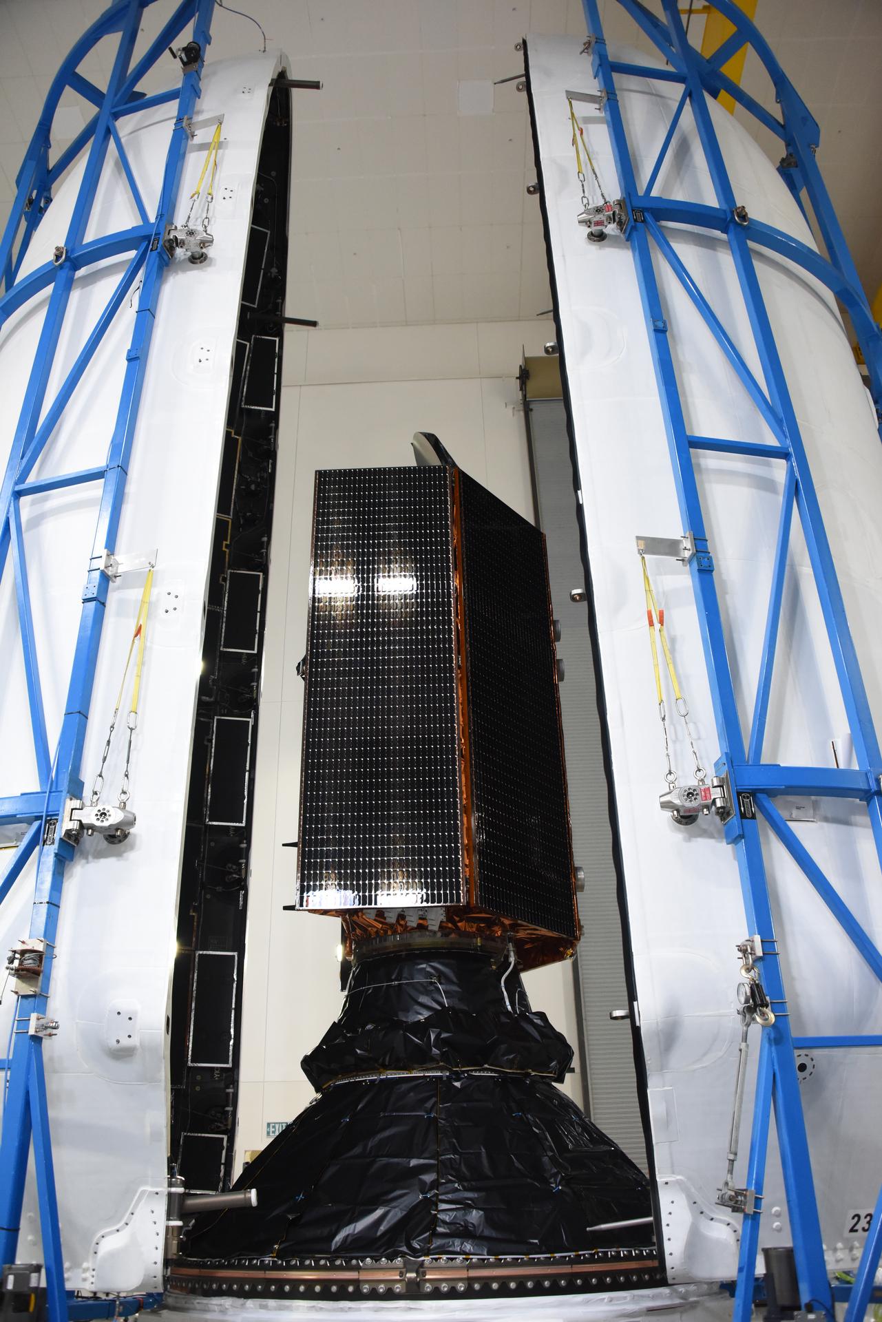 Technicians and engineers encapsulate the Sentinel-6B spacecraft within a protective payload fairing inside the Astrotech Space Operations facility at Vandenberg Space Force Base in California, on Monday, Nov. 10, 2025. A collaboration between NASA, ESA (European Space Agency), EUMETSAT (European Organisation for the Exploitation of Meteorological Satellites), and the National Oceanic and Atmospheric Administration (NOAA), Sentinel-6B is designed to measure sea levels down to roughly an inch for about 90% of the world’s oceans. NASA is targeting launch no earlier than Sunday, Nov. 16, on a SpaceX Falcon 9 rocket from Space Launch Complex 4 East at Vandenberg.