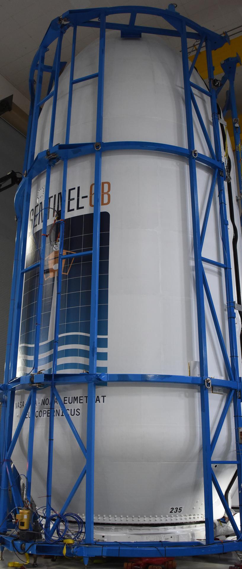 Technicians and engineers encapsulate the Sentinel-6B spacecraft within a protective payload fairing inside the Astrotech Space Operations facility at Vandenberg Space Force Base in California, on Monday, Nov. 10, 2025. A collaboration between NASA, ESA (European Space Agency), EUMETSAT (European Organisation for the Exploitation of Meteorological Satellites), and the National Oceanic and Atmospheric Administration (NOAA), Sentinel-6B is designed to measure sea levels down to roughly an inch for about 90% of the world’s oceans. NASA is targeting launch no earlier than Sunday, Nov. 16, on a SpaceX Falcon 9 rocket from Space Launch Complex 4 East at Vandenberg.