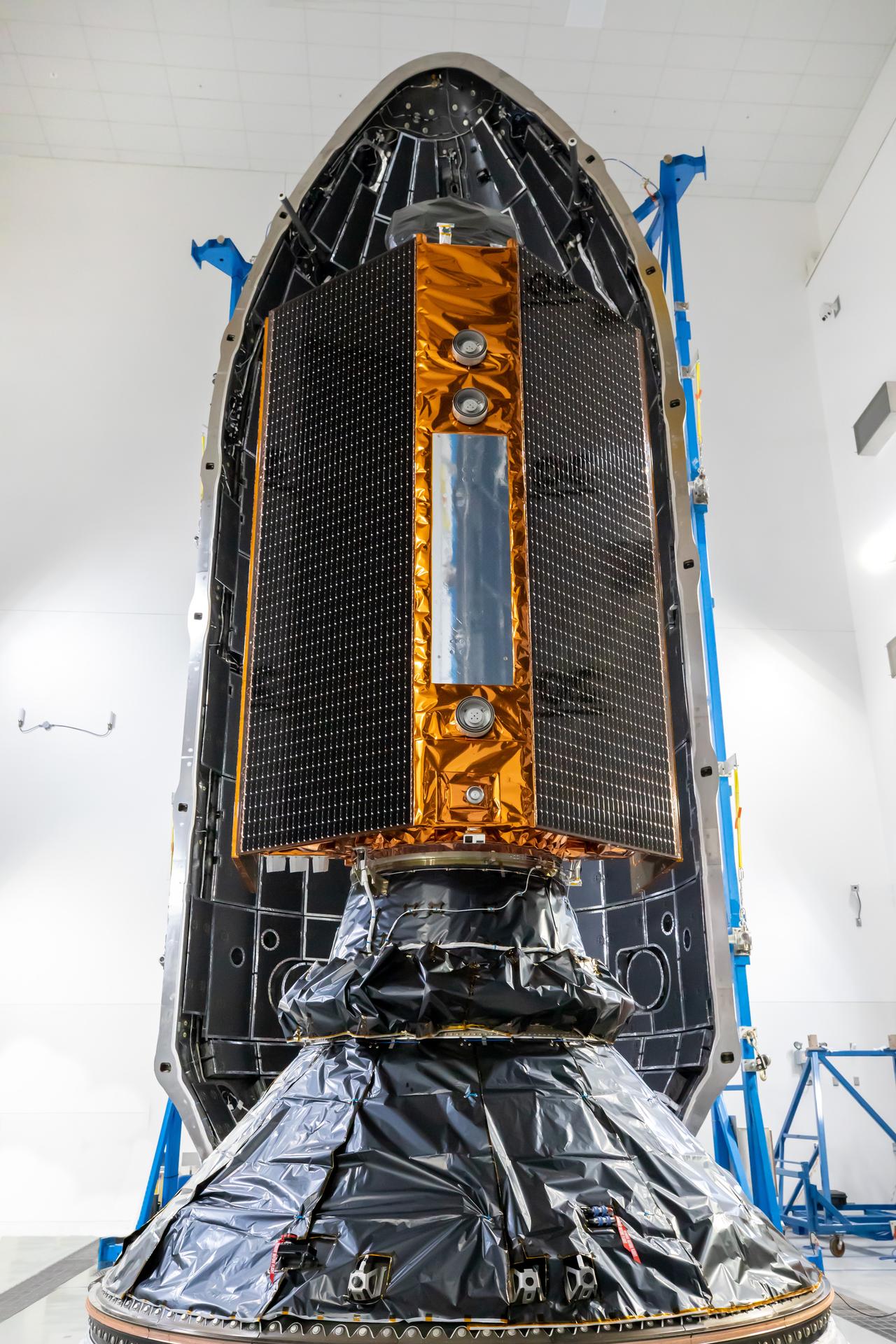 Technicians and engineers encapsulate the Sentinel-6B spacecraft within a protective payload fairing inside the Astrotech Space Operations facility at Vandenberg Space Force Base in California, on Monday, Nov. 10, 2025. A collaboration between NASA, ESA (European Space Agency), EUMETSAT (European Organisation for the Exploitation of Meteorological Satellites), and the National Oceanic and Atmospheric Administration (NOAA), Sentinel-6B is designed to measure sea levels down to roughly an inch for about 90% of the world’s oceans. NASA is targeting launch no earlier than Sunday, Nov. 16, on a SpaceX Falcon 9 rocket from Space Launch Complex 4 East at Vandenberg.