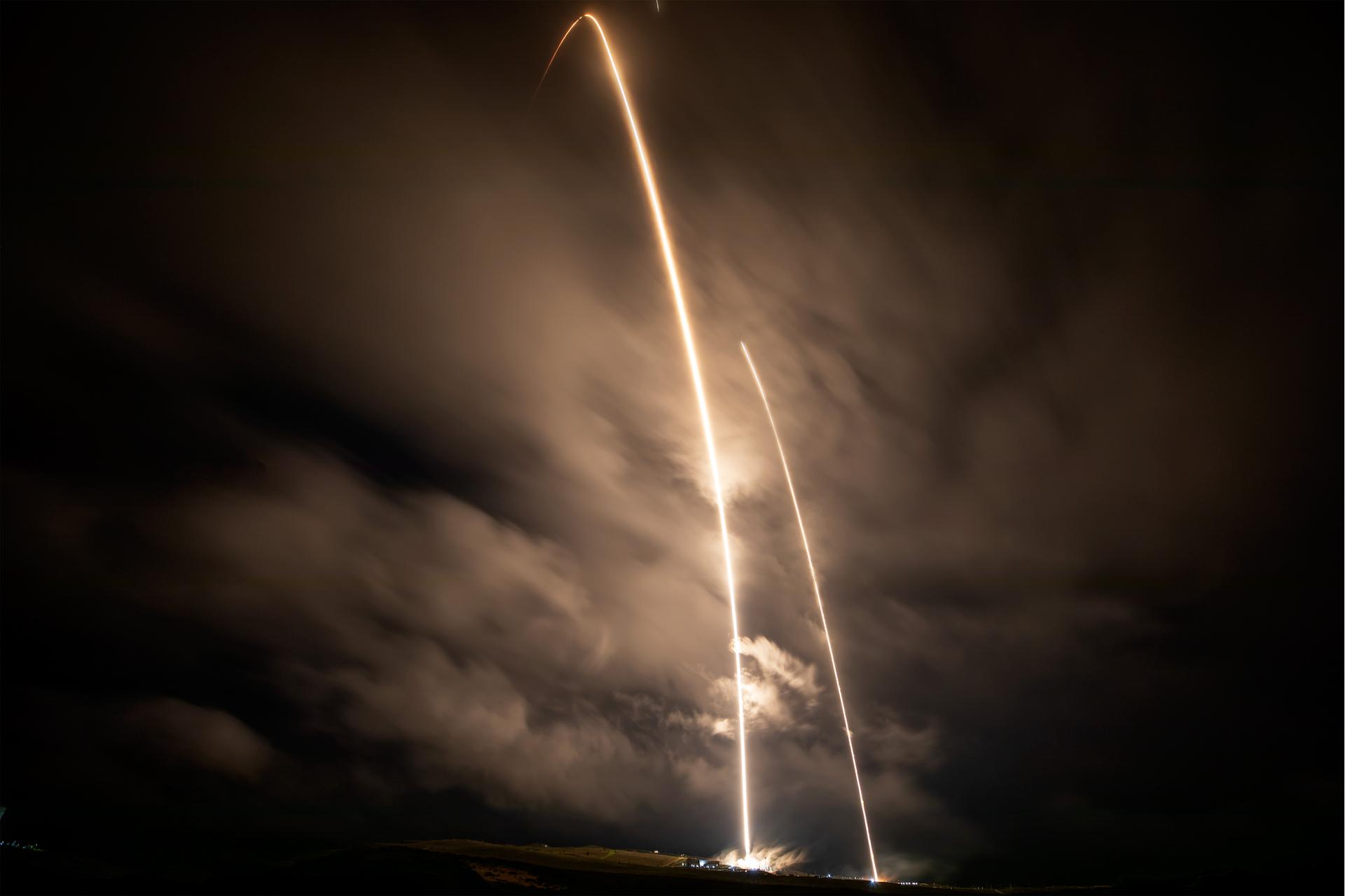 Imageshows A long exposure photo shows two streaks – the SpaceX Falcon 9 rocket carrying the international Sentinel-6B spacecraft lifting off from Space Launch Complex 4 East at Vandenberg Space Force Base in California at 9:21 p.m. PST Sunday, Nov. 16, 2025, and the rocket’s first stage returning minutes later to land at Vandenberg’s Landing Zone 4 East. A collaboration between NASA, ESA (European Space Agency), EUMETSAT (European Organisation for the Exploitation of Meteorological Satellites), and the National Oceanic and Atmospheric Administration (NOAA), Sentinel-6B is designed to measure sea levels down to roughly an inch for about 90% of the world’s oceans. Photo credit: SpaceX