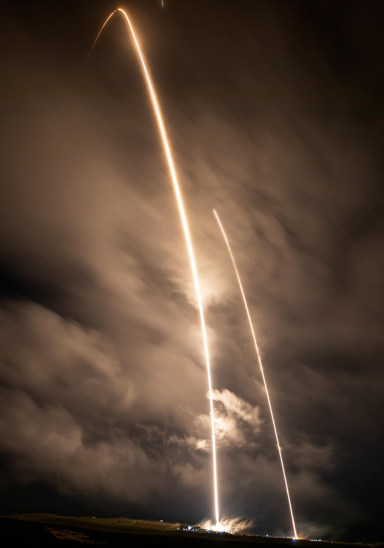 A long exposure photo shows two streaks – the SpaceX Falcon 9 rocket carrying the international Sentinel-6B spacecraft lifting off from Space Launch Complex 4 East at Vandenberg Space Force Base in California at 9:21 p.m. PST Sunday, Nov. 16, 2025, and the rocket’s first stage returning minutes later to land at Vandenberg’s Landing Zone 4 East. A collaboration between NASA, ESA (European Space Agency), EUMETSAT (European Organisation for the Exploitation of Meteorological Satellites), and the National Oceanic and Atmospheric Administration (NOAA), Sentinel-6B is designed to measure sea levels down to roughly an inch for about 90% of the world’s oceans.