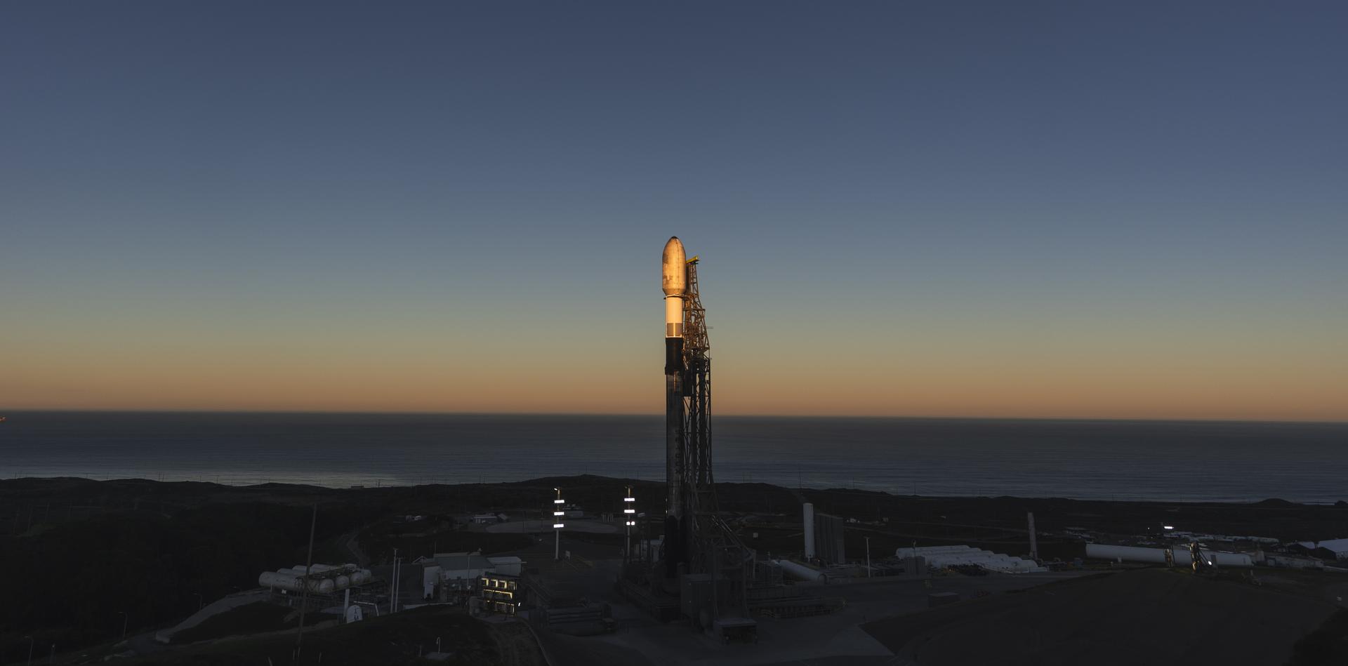 A SpaceX Falcon 9 rocket carrying NASA’s R5-S7 (Realizing Rapid, Reduced-cost high-Risk Research project Spacecraft 7) CubeSat along with several other satellites as part of the company’s Transporter-15 mission stands vertical on the launch pad of Space Launch Complex 4 East at Vandenberg Space Force Base in California on Wednesday, Nov. 26, 2025. The latest in a series of spacecraft, R5-S7 will explore ways to get multiple technology prototypes into low Earth orbit rapidly and at a low cost, accelerating the demonstration of these technologies in orbit and allowing engineers and scientists to more quickly prove them and make them available to NASA missions and other users.