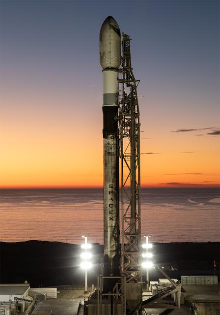 A SpaceX Falcon 9 rocket carrying NASA’s R5-S7 (Realizing Rapid, Reduced-cost high-Risk Research project Spacecraft 7) CubeSat along with several other satellites as part of the company’s Transporter-15 mission stands vertical on the launch pad of Space Launch Complex 4 East at Vandenberg Space Force Base in California on Thursday, Nov. 27, 2025. The latest in a series of spacecraft, R5-S7 will explore ways to get multiple technology prototypes into low Earth orbit rapidly and at a low cost, accelerating the demonstration of these technologies in orbit and allowing engineers and scientists to more quickly prove them and make them available to NASA missions and other users.