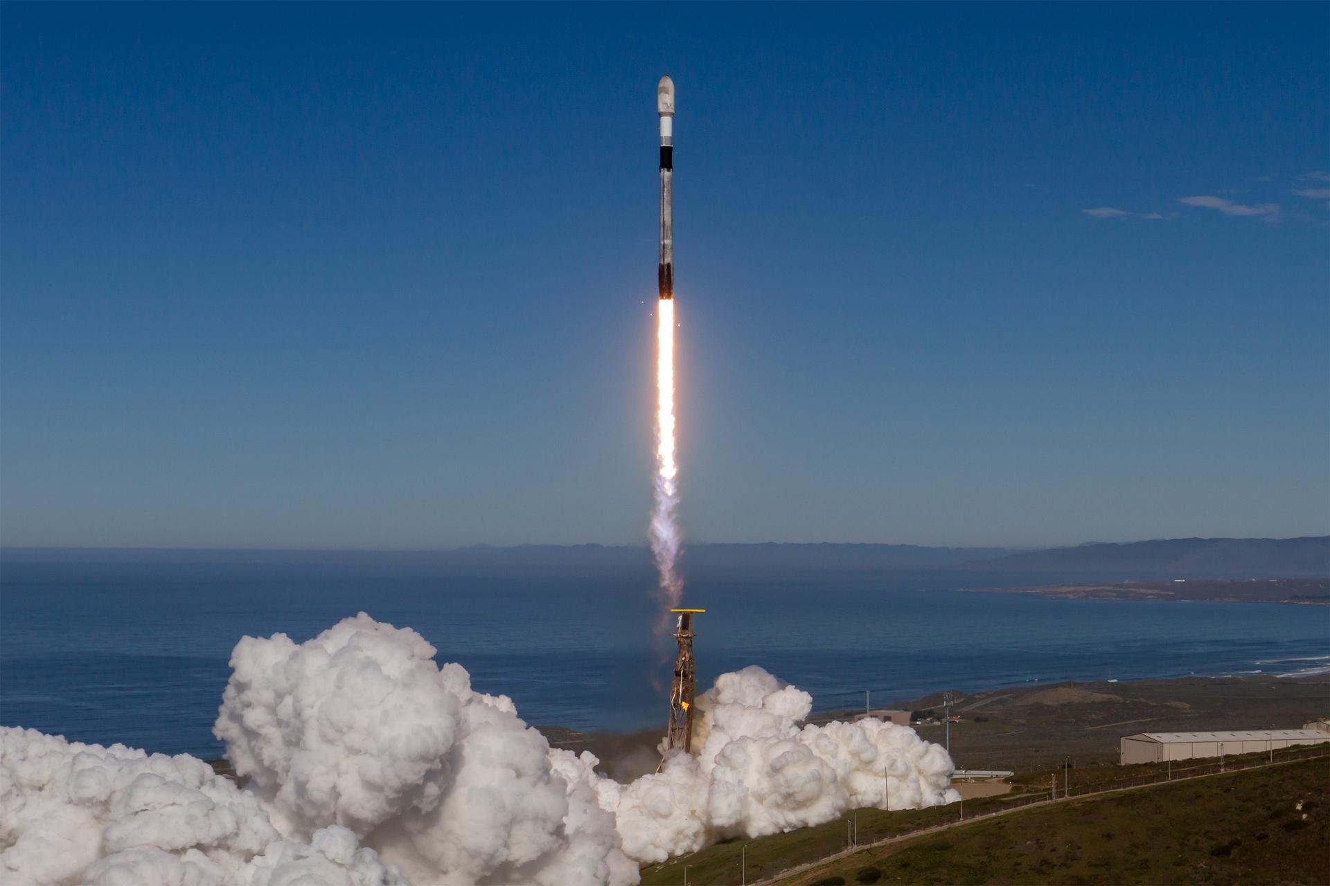 Image shows blue, clear skies during the launch of a SpaceX Falcon 9 rocket carrying NASA’s R5-S7 (Realizing Rapid, Reduced-cost high-Risk Research project Spacecraft 7) CubeSat along with several other satellites as part of the company’s Transporter-15 mission from Space Launch Complex 4 East at Vandenberg Space Force Base in California at 10:44 a.m. PST Friday, Nov. 28, 2025. Photo credit: SpaceX