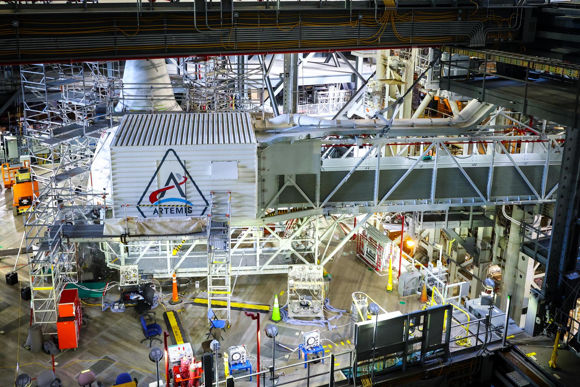 A freshly painted NASA’s Artemis logo is unveiled on the White Room connected to the crew access arm and mobile launcher inside the Vehicle Assembly Building at NASA’s Kennedy Space Center in Florida on Thursday, Dec. 4, 2025. The White Room is the area where the Artemis II crew Reid Wiseman, Victor Glover, Christina Koch, and CSA (Canadian Space Agency) astronaut Jeremy Hansen will enter the Orion spacecraft ahead of launch from Launch Complex 39B at NASA Kennedy in early 2026.