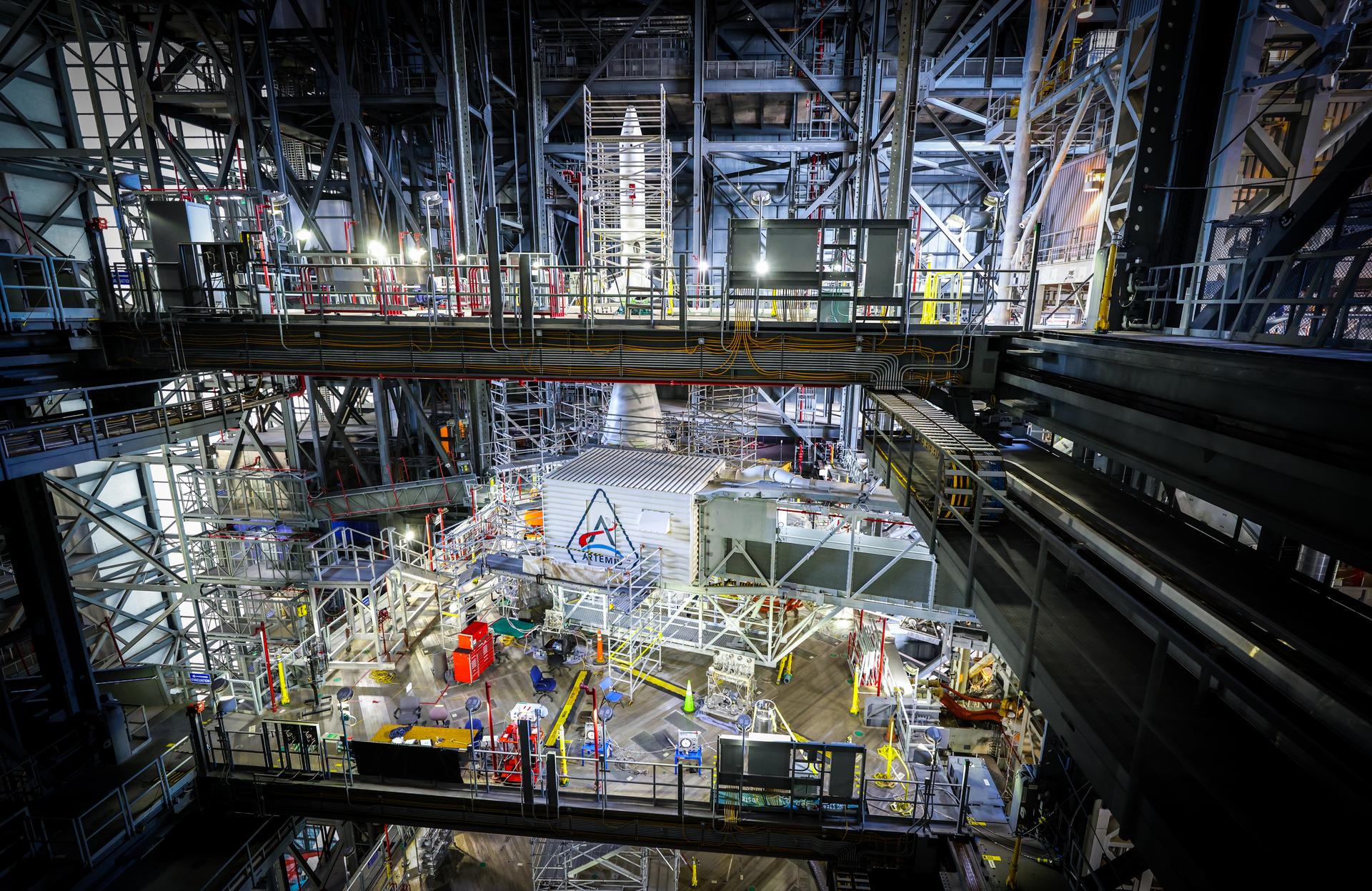 A freshly painted NASA’s Artemis logo is unveiled on the White Room connected to the crew access arm and mobile launcher inside the Vehicle Assembly Building at NASA’s Kennedy Space Center in Florida on Thursday, Dec. 4, 2025. The White Room is the area where the Artemis II crew Reid Wiseman, Victor Glover, Christina Koch, and CSA (Canadian Space Agency) astronaut Jeremy Hansen will enter the Orion spacecraft ahead of launch from Launch Complex 39B at NASA Kennedy in early 2026.