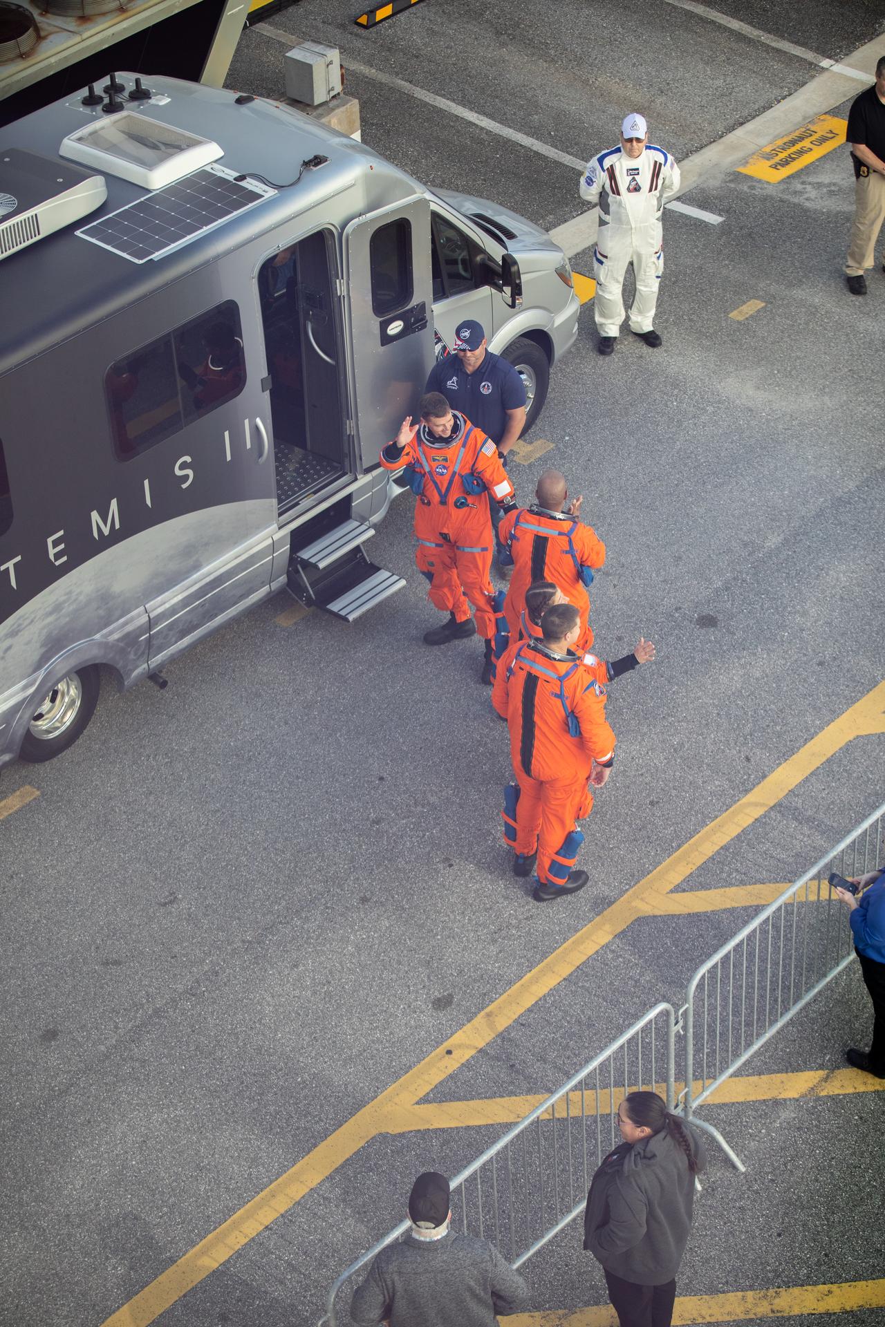 From left, NASA astronauts Reid Wiseman, Artemis II commander, Victor Glover, Artemis II pilot, Christina Koch, Artemis II mission specialist and CSA (Canadian Space Agency) astronaut Jeremy Hansen, Artemis II mission specialist, depart the Neil A. Armstrong Operations and Checkout Building to travel to the Vehicle Assembly Building to board their Orion spacecraft atop NASA’s SLS (Space Launch System) rocket as part of the Artemis II Countdown Demonstration Test on Saturday, Dec. 20, 2025 at NASA’s Kennedy Space Center in Florida. For this operation, the Artemis II crew and launch team are simulating the launch day timeline including suit-up, walkout, and climbing in and out of the spacecraft. Through the Artemis campaign, NASA will send astronauts to explore the Moon for scientific discovery, economic benefits, and to build the foundation for the first crewed missions to Mars, for the benefit of all.