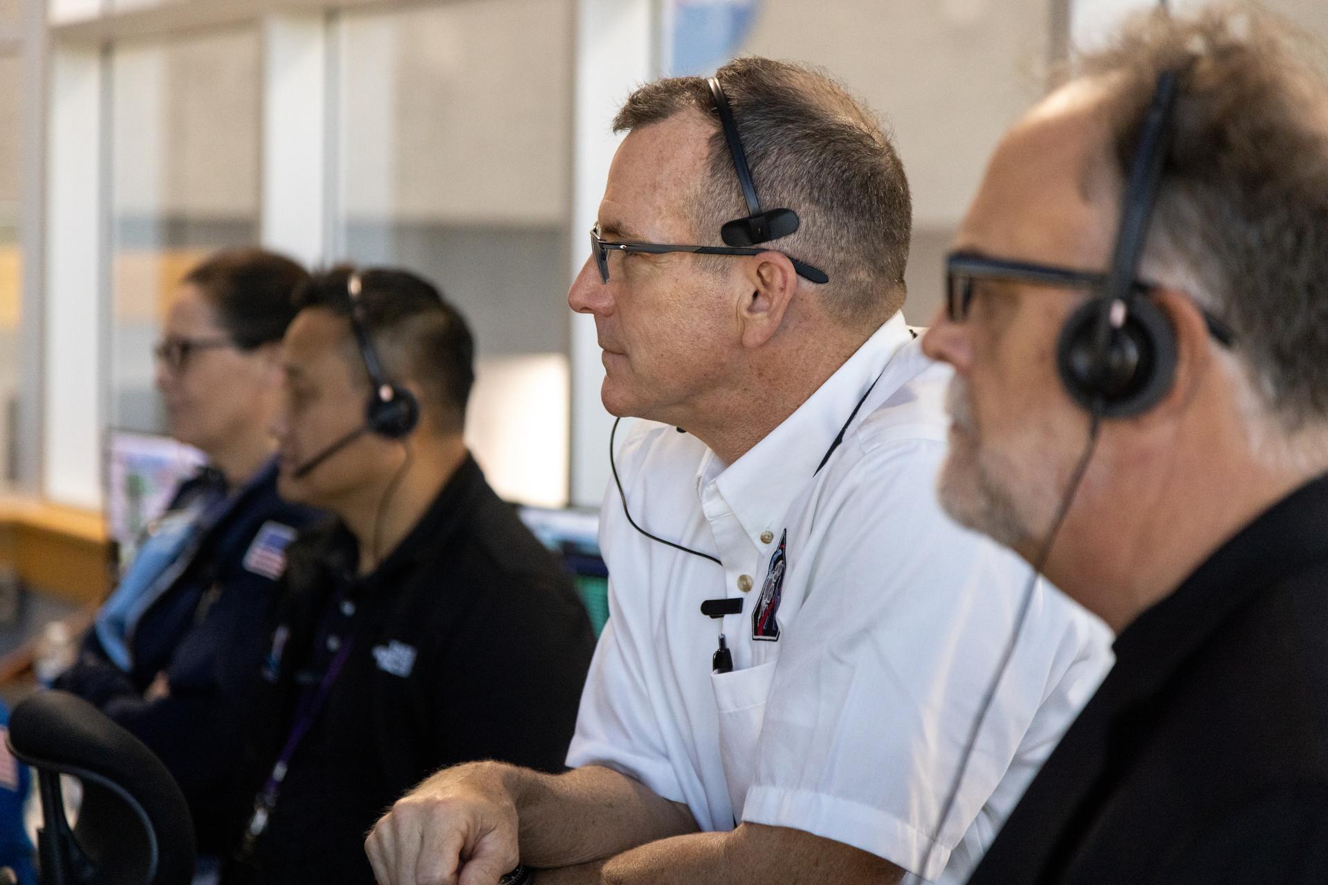 From right, Shawn Quinn NASA’s Exploration Ground Systems program manager; Cliff Lanham, NASA’s Exploration Ground Systems deputy program manager; and Howard Hu, Orion program manager, monitor the progress of a countdown demonstration test with Artemis II crewmembers NASA astronauts Reid Wiseman, commander; Victor Glover, pilot; Christina Koch, mission specialist; and CSA (Canadian Space Agency) astronaut Jeremy Hansen, mission specialist onboard their Orion spacecraft from Firing Room 1 of the Rocco A. Petrone Launch Control Center, Saturday, Dec. 20, 2025, at NASA’s Kennedy Space Center in Florida. For this operation, the Artemis II crew and launch teams are simulating the launch day timeline including suit-up, walkout, and spacecraft ingress and egress. Through the Artemis campaign, NASA will send astronauts to explore the Moon for scientific discovery, economic benefits, and to build the foundation for the first crewed missions to Mars, for the benefit of all.
