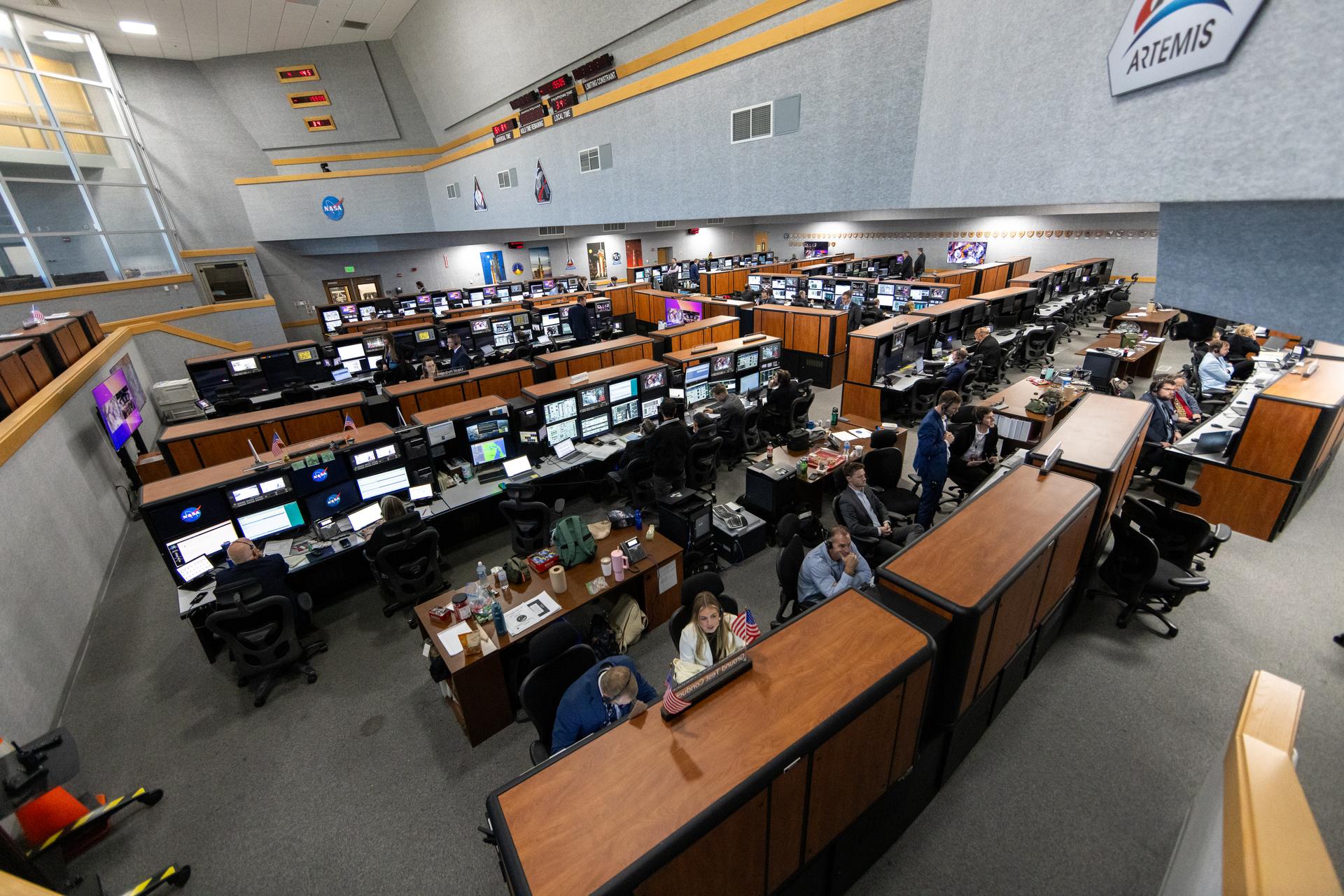 Teams monitor the progress of a countdown demonstration test with Artemis II crewmembers NASA astronauts Reid Wiseman, commander; Victor Glover, pilot; Christina Koch, mission specialist; and CSA (Canadian Space Agency) astronaut Jeremy Hansen, mission specialist onboard their Orion spacecraft from Firing Room 1 of the Rocco A. Petrone Launch Control Center, Saturday, Dec. 20, 2025, at NASA’s Kennedy Space Center in Florida. For this operation, the Artemis II crew and launch teams are simulating the launch day timeline including suit-up, walkout, and spacecraft ingress and egress. Through the Artemis campaign, NASA will send astronauts to explore the Moon for scientific discovery, economic benefits, and to build the foundation for the first crewed missions to Mars, for the benefit of all.