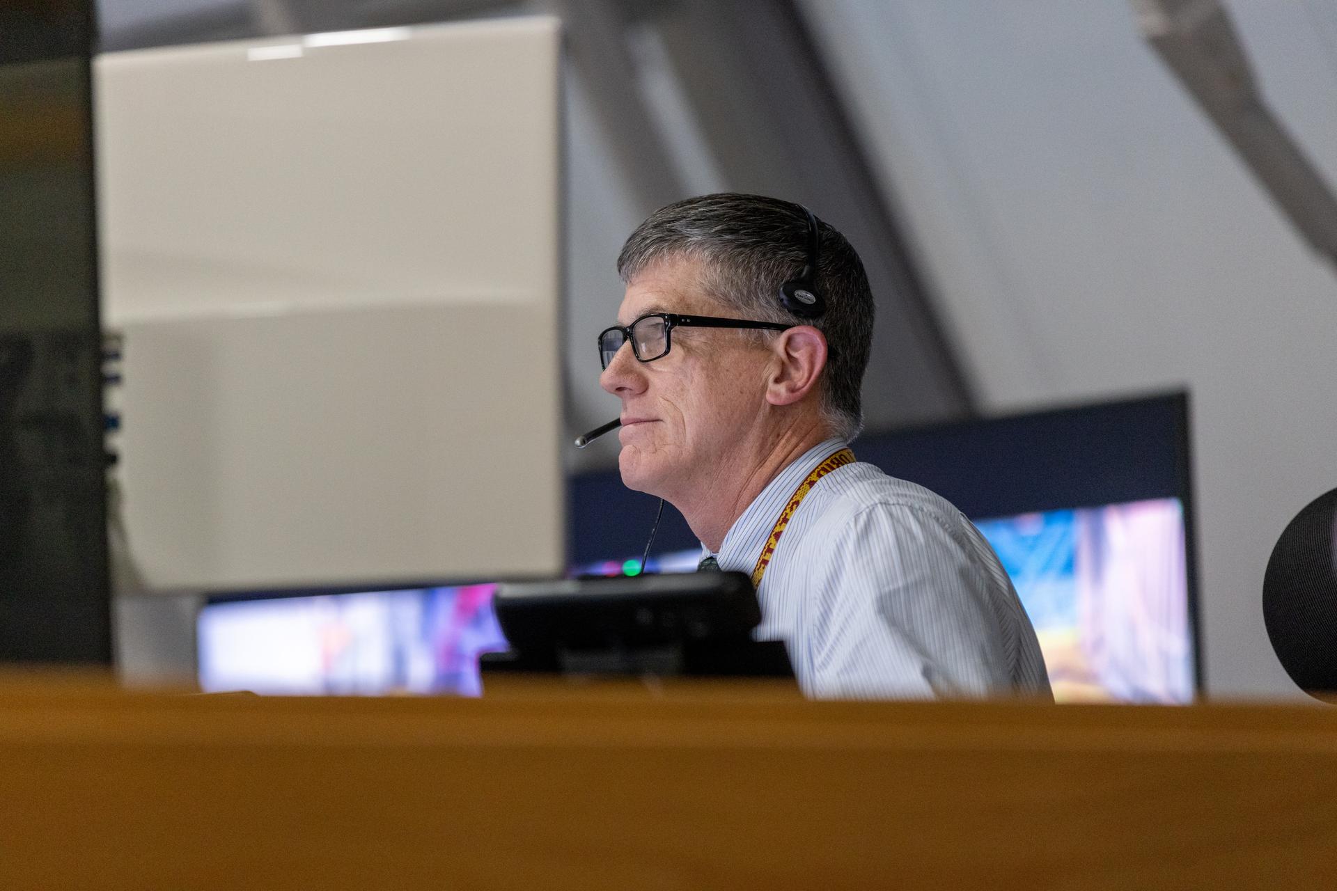 Jeremy Graeber, assistant launch director, monitors the progress of a countdown demonstration test with Artemis II crewmembers NASA astronauts Reid Wiseman, commander; Victor Glover, pilot; Christina Koch, mission specialist; and CSA (Canadian Space Agency) astronaut Jeremy Hansen, mission specialist onboard their Orion spacecraft from Firing Room 1 of the Rocco A. Petrone Launch Control Center, Saturday, Dec. 20, 2025, at NASA’s Kennedy Space Center in Florida. For this operation, the Artemis II crew and launch teams are simulating the launch day timeline including suit-up, walkout, and spacecraft ingress and egress. Through the Artemis campaign, NASA will send astronauts to explore the Moon for scientific discovery, economic benefits, and to build the foundation for the first crewed missions to Mars, for the benefit of all.