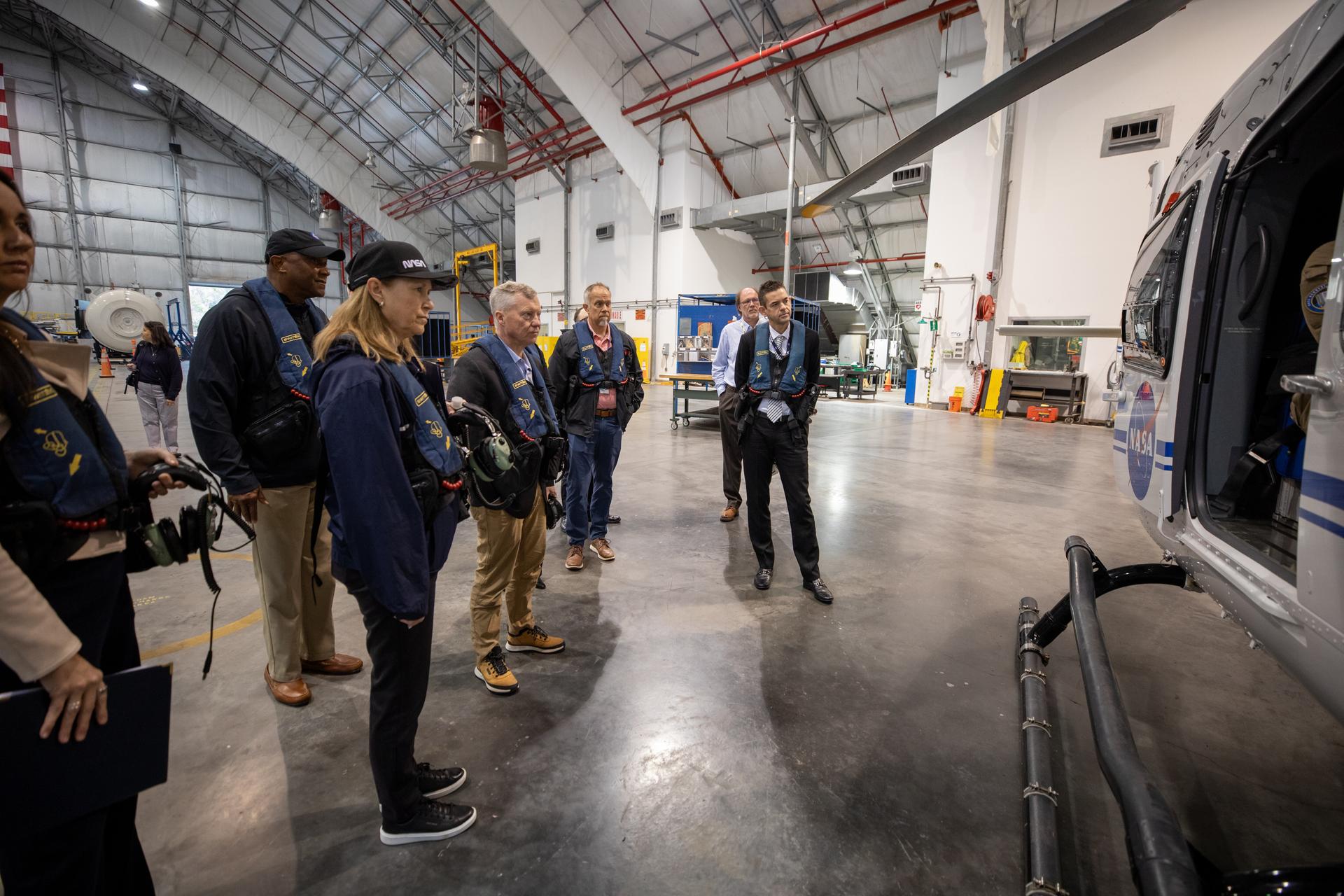 NASA Administrator Jared Isaacman (right) and leadership from the agency’s Kennedy Space Center in Florida prepare to board NASA Airbus H135 (T3) helicopters for an aerial tour of the spaceport during the administrator’s visit on Tuesday, Jan. 13, 2026. Participants on the helicopter tour include, from left, Kennedy Space Center Deputy Director Kelvin Manning; Kennedy Space Center Director Janet Petro; Todd Ericson, senior advisor to the NASA administrator; Kennedy Space Center Chief of Staff Trey Carlson; John Graves, NASA senior project manager, and Isaacman. Isaacman, NASA’s 15th administrator, began visiting the agency’s centers after his appointment on Dec. 17, 2025, to meet with employees, contractors, and partners.