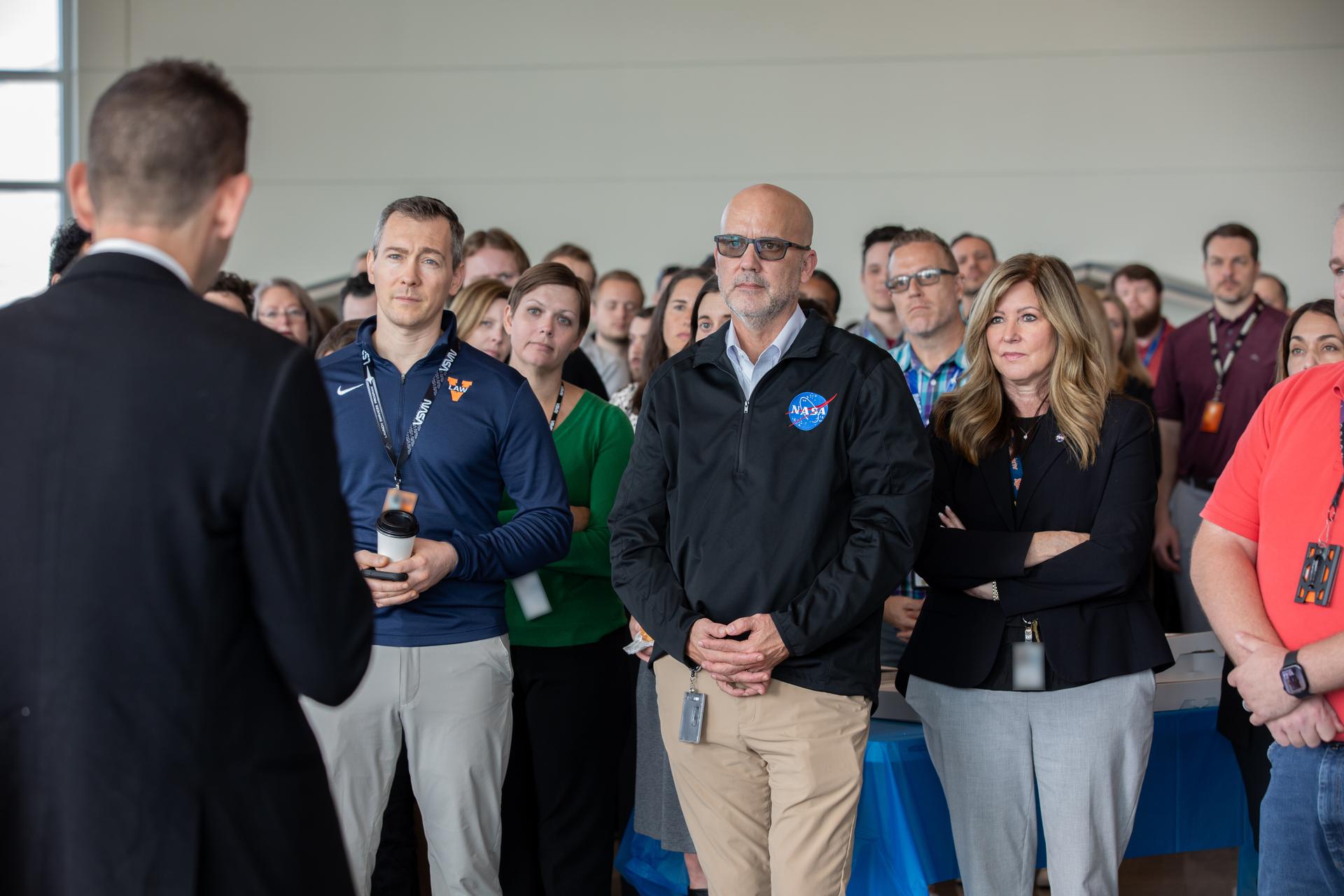 NASA Administrator Jared Isaacman (far left) speaks with NASA employees during his visit to the agency’s Kennedy Space Center in Florida, on Tuesday, Jan. 13, 2026, including, from right, Jennifer Kunz, associate director, technical, NASA Kennedy; Michael Beaupre, director, human resources, NASA Kennedy; and Louis Shernisky, NASA Launch Services Program counsel. Isaacman, NASA’s 15th administrator, began visiting the agency’s centers after his appointment on Dec. 17, 2025, to meet with employees, contractors, and partners.