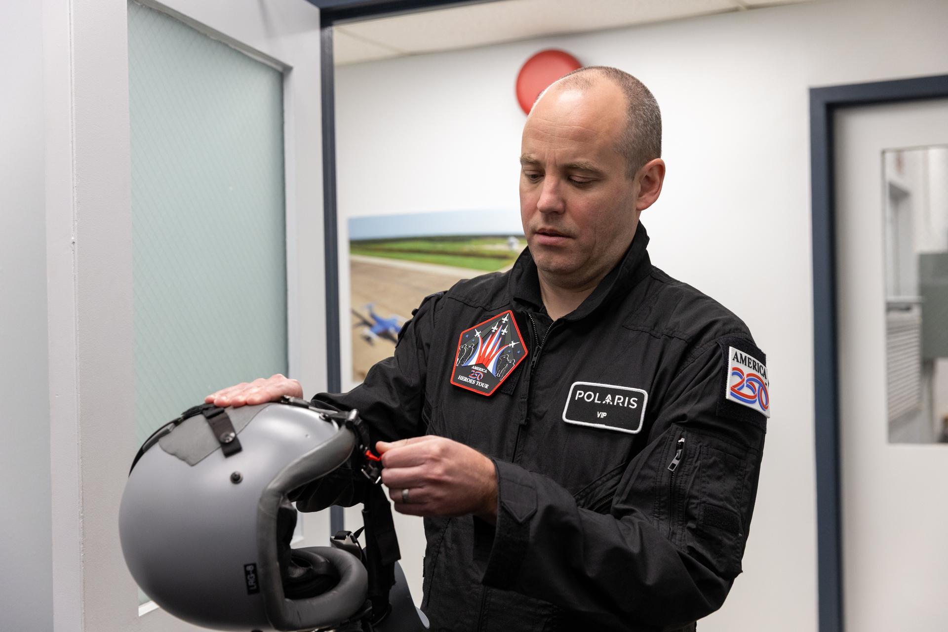Daniel Forrestel, manager, Ground and Missions Operations Office of NASA’s Commercial Crew Program at the agency’s Kennedy Space Center in Florida, prepares to put on a flight helmet on Tuesday, Jan. 13, 2026. NASA Administrator Jared Isaacman flew Forrestel on an employee incentive flight in Isaacman’s personal Northrop F-5 Tiger II aircraft around NASA Kennedy. As the newly appointed 15th administrator of the agency, Isaacman created a ride-along program to recognize and reward members of the workforce for their dedication to accomplishing agency priorities.  