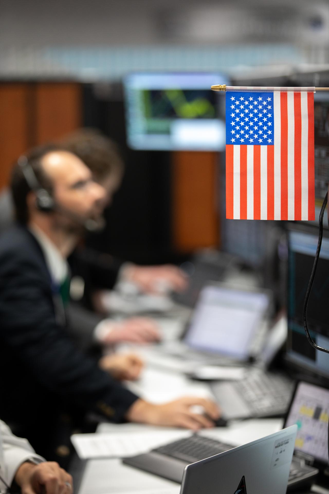 An American flag displays inside Firing Room 1 of the Rocco A. Petrone Launch Control Center while members of NASA’s Exploration Ground Systems participate in the Artemis II terminal count simulation on Wednesday, Jan. 14, 2026, at NASA’s Kennedy Space Center in Florida. The terminal count simulation runs through the final five hours of launch countdown, include terminal count - the remaining 10 minutes of the countdown - for NASA’s Artemis II test flight which will take Commander Reid Wiseman, Pilot Victor Glover, and Mission Specialist Christina Koch from NASA, and Mission Specialist Jeremy Hansen from the CSA (Canadian Space Agency), around the Moon and back to Earth no later than no later than April 2026 from Launch Complex 39B at NASA Kennedy.