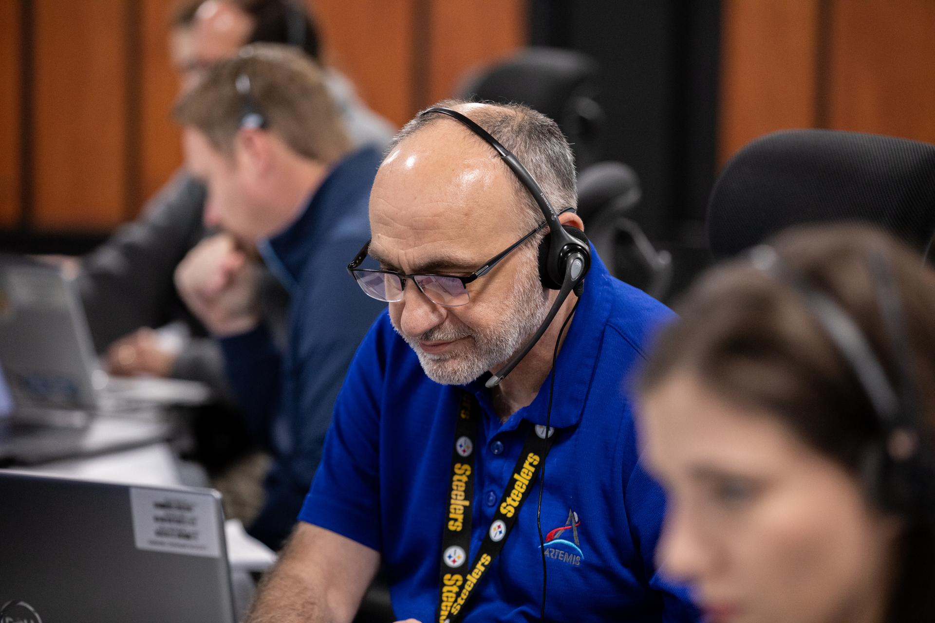 Alex Pandelos, ground launch sequencer operator, participates in a cryogenic propellant loading simulation on Thursday, Jan. 15, 2026, inside Firing Room 1 of the Rocco A. Petrone Launch Control Center at NASA’s Kennedy Space Center in Florida. Members of NASA’s Exploration Ground Systems team rehearse the steps to load the super-cooled liquid hydrogen and liquid oxygen into the SLS (Space Launch System) rocket core stage and interim cryogenic propulsion stage, a process that starts approximately nine hours before liftoff for the Artemis II mission. The test flight will take Commander Reid Wiseman, Pilot Victor Glover, and Mission Specialist Christina Koch from NASA, and Mission Specialist Jeremy Hansen from the CSA (Canadian Space Agency), around the Moon and back to Earth no later than no later than April 2026 from Launch Complex 39B at NASA Kennedy.