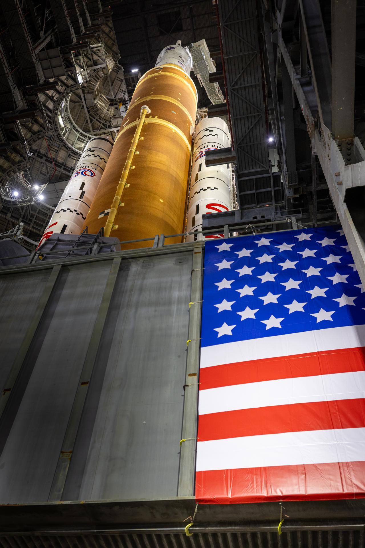 NASA’s Artemis II SLS (Space Launch System) rocket and Orion spacecraft, secured to the mobile launcher, prepares to roll out from the Vehicle Assembly Building to Launch Complex 39B at NASA’s Kennedy Space Center in Florida on Saturday, Jan. 17, 2026. The Artemis II test flight will take Commander Reid Wiseman, Pilot Victor Glover, and Mission Specialist Christina Koch from NASA, and Mission Specialist Jeremy Hansen from the CSA (Canadian Space Agency), around the Moon and back to Earth no later than April 2026.