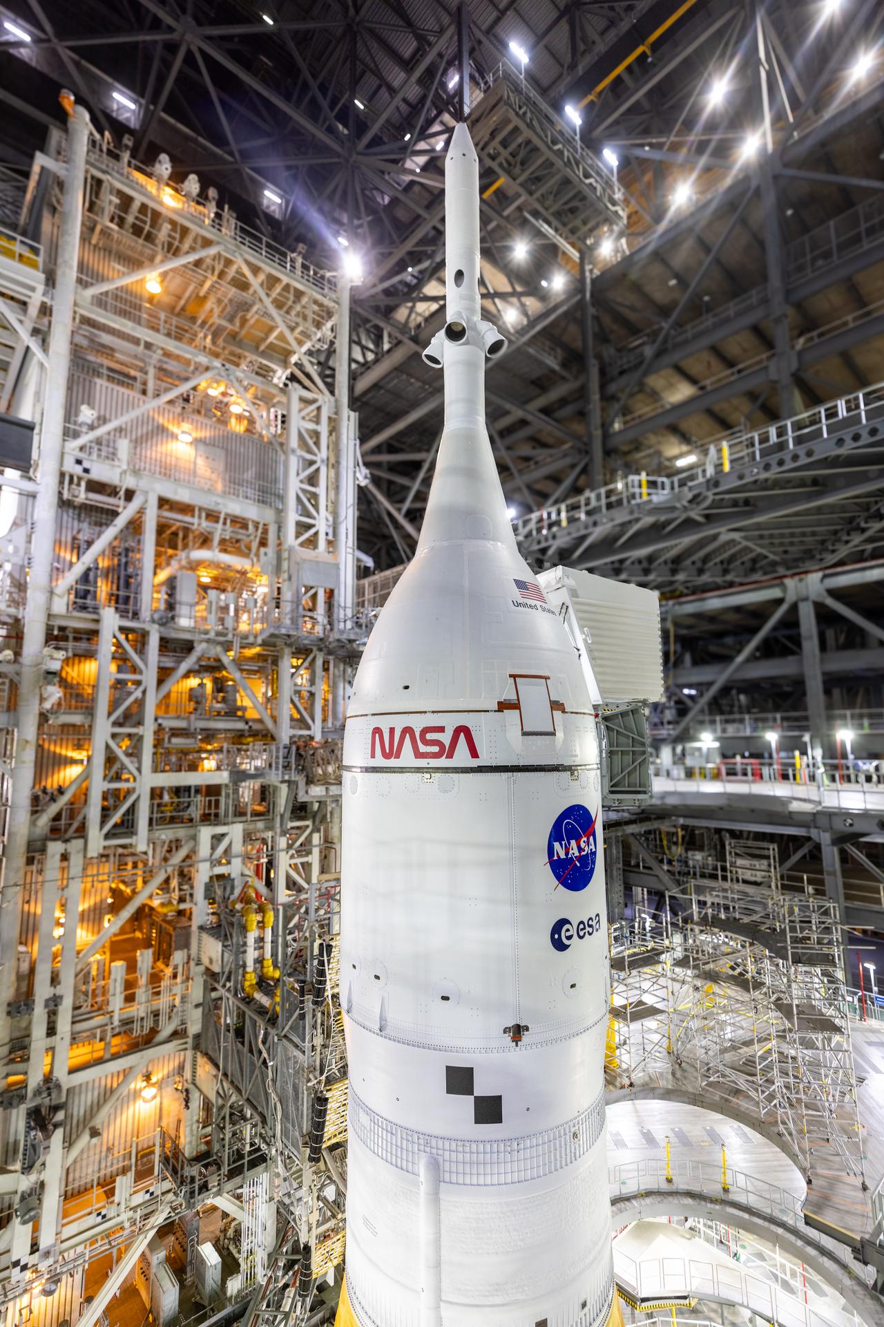 A closeup view of NASA’s Orion spacecraft with the launch abort system atop secured to NASA’s crawler-transporter 2 and the agency’s Artemis II SLS (Space Launch System) rocket prepares to roll out from the Vehicle Assembly Building to Launch Complex 39B at NASA’s Kennedy Space Center in Florida on Saturday, Jan. 17, 2026. The Artemis II test flight will take Commander Reid Wiseman, Pilot Victor Glover, and Mission Specialist Christina Koch from NASA, and Mission Specialist Jeremy Hansen from the CSA (Canadian Space Agency), around the Moon and back to Earth no later than April 2026.